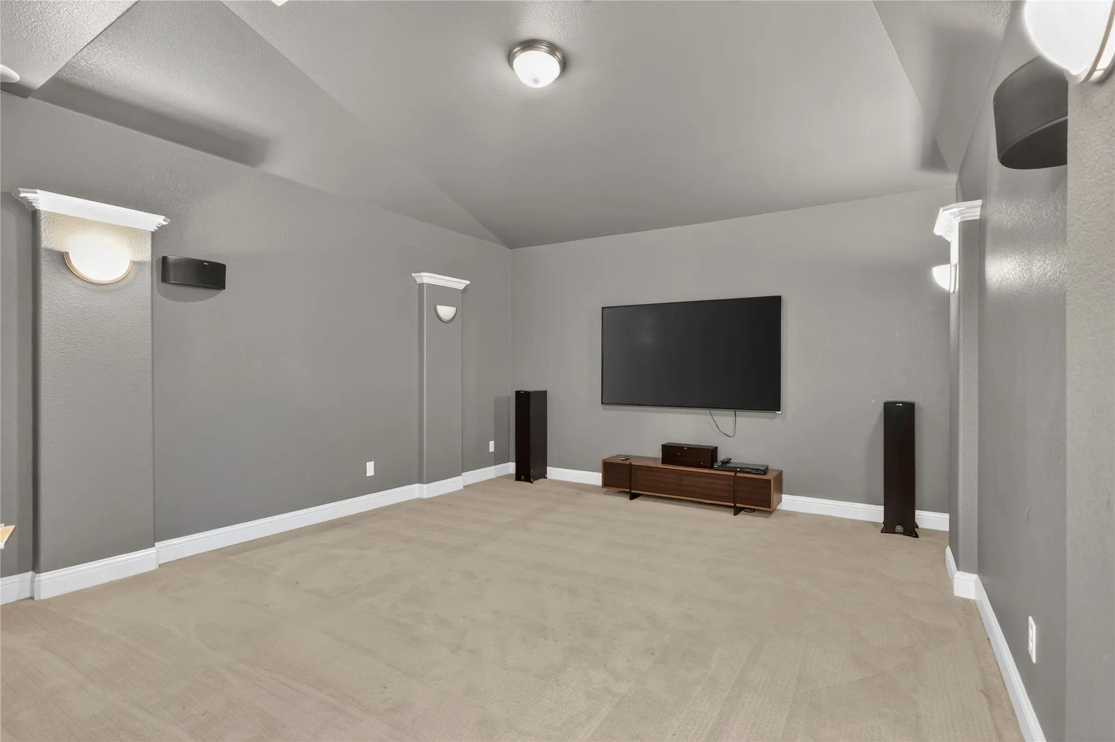 Media room, includes TV and sound system.