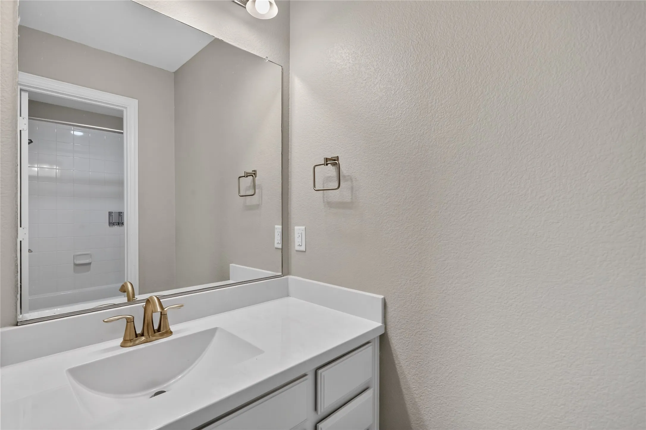 Jack and jill bathroom 1, with shower in the background.