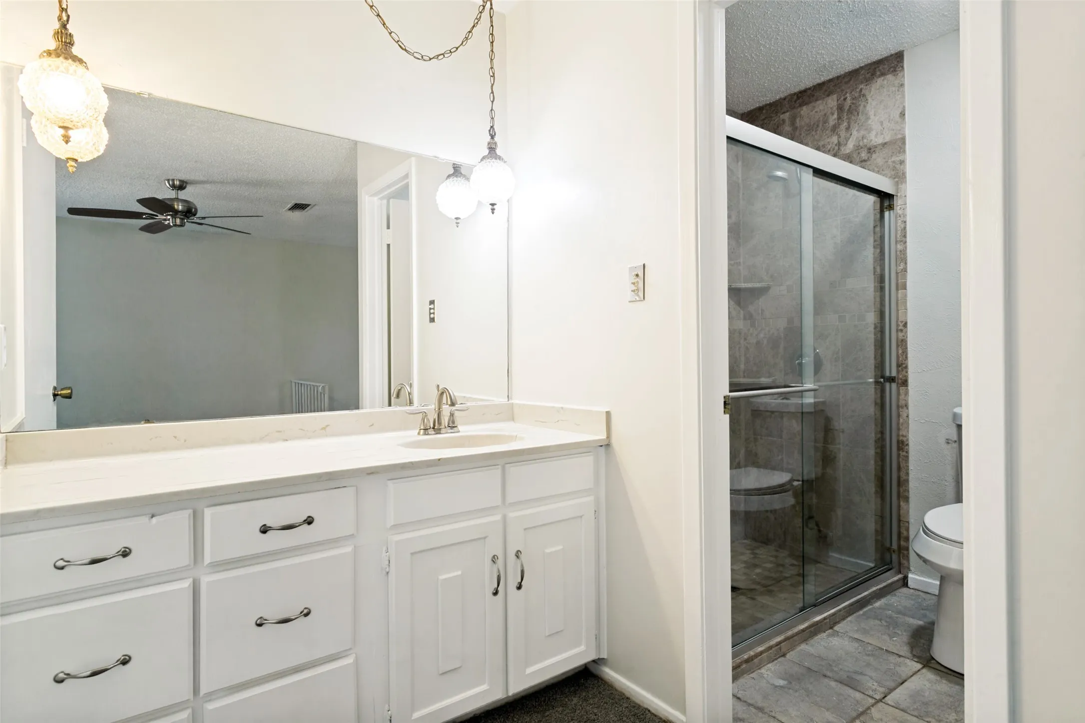 The primary bathroom offers good space to start and end your day comfortably. A convenient private bath adds to the appeal of the primary suite.