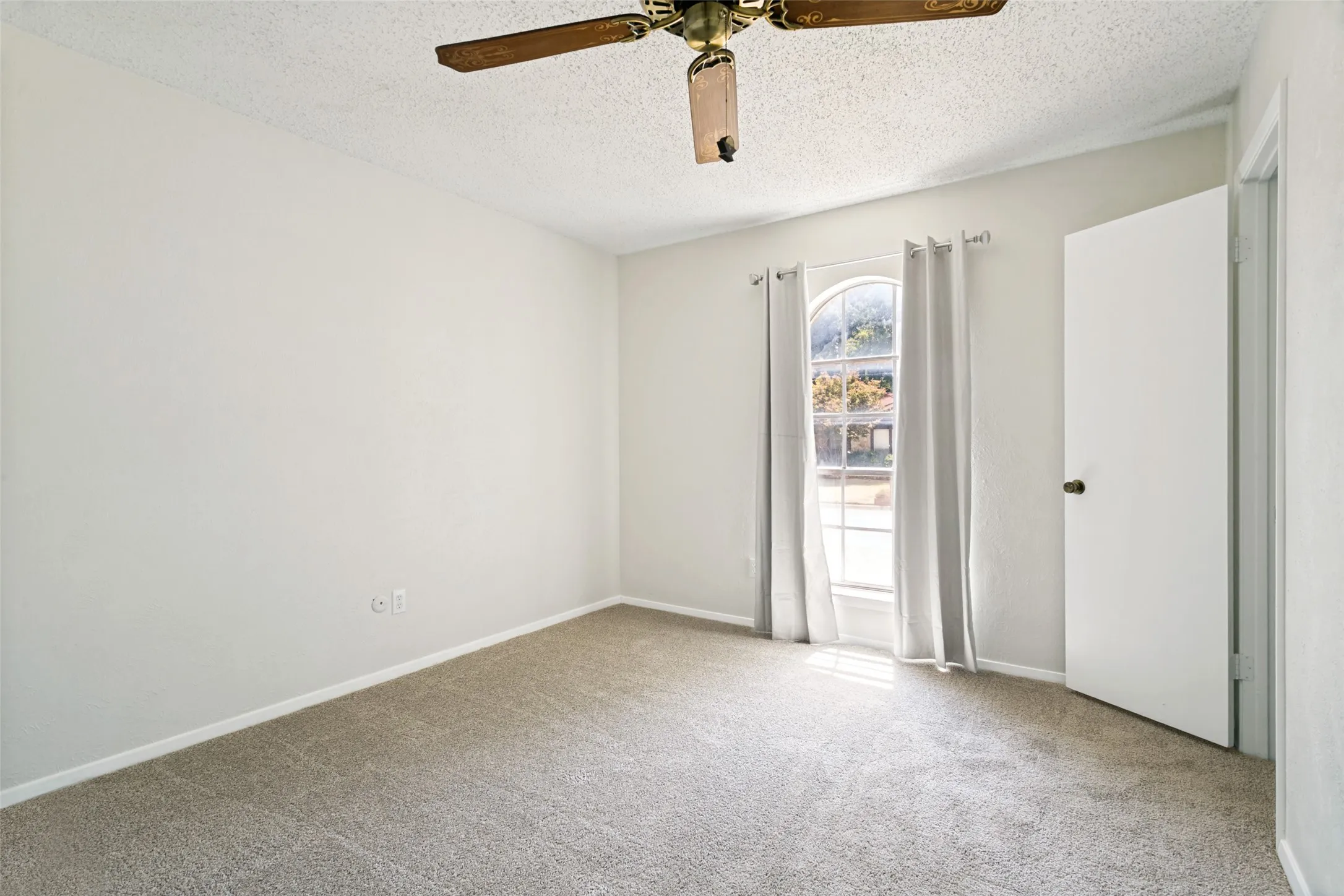 The third bedroom features brand-new carpet.
