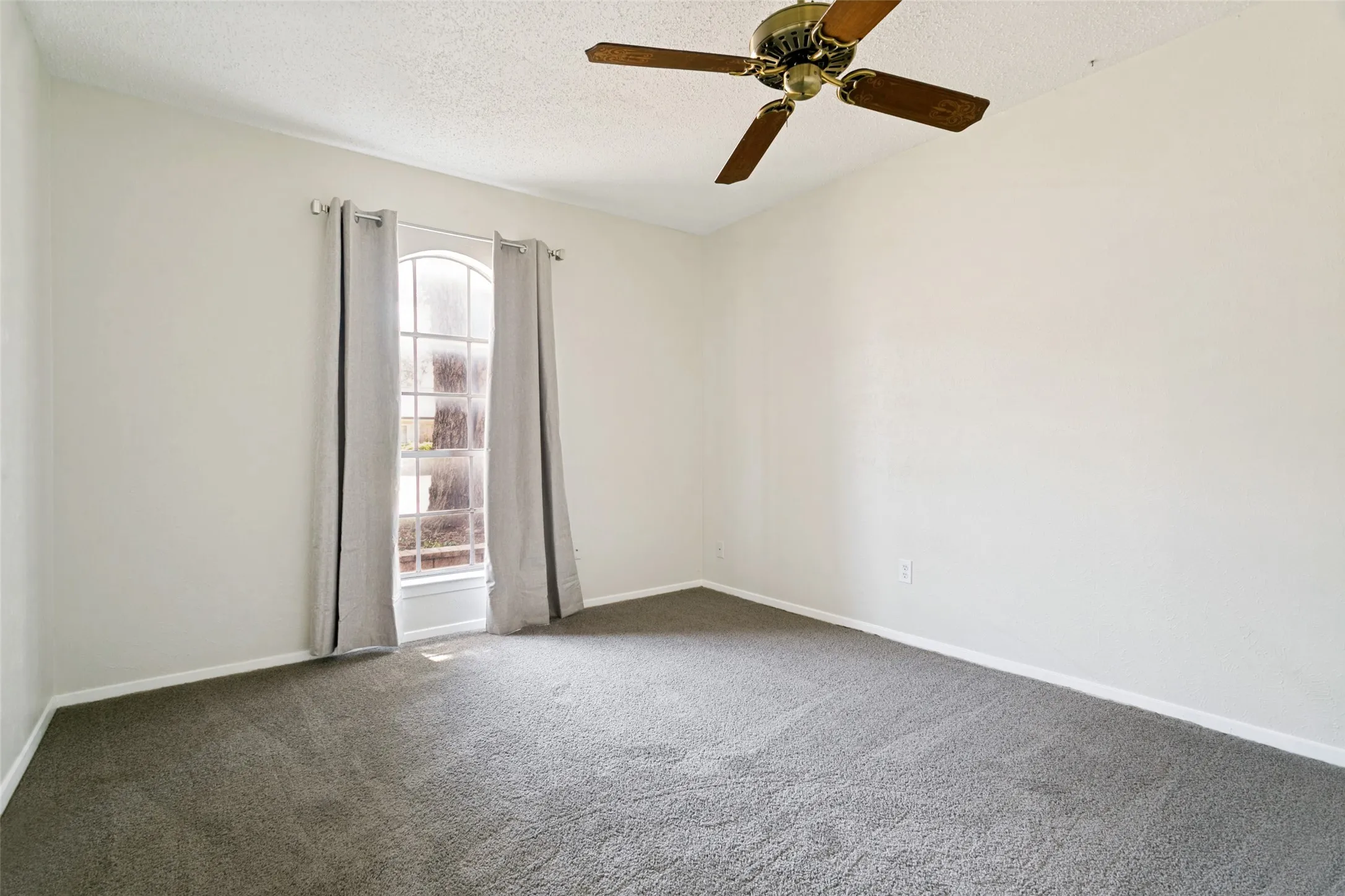 The second bedroom features brand-new carpet. Perfect for a guest room or home office.