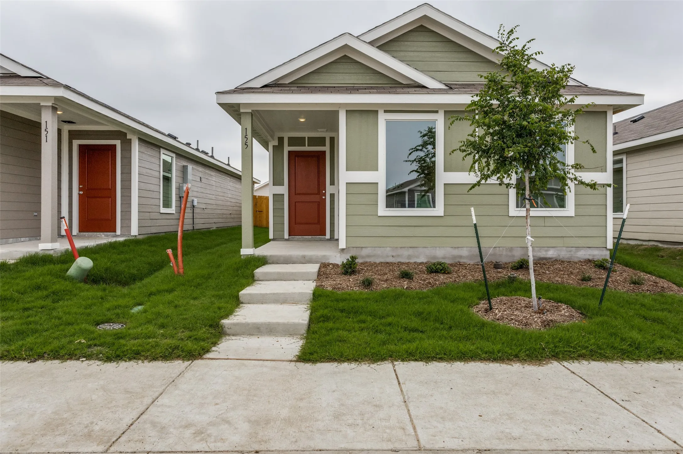 Bungalow-style home with a front yard
