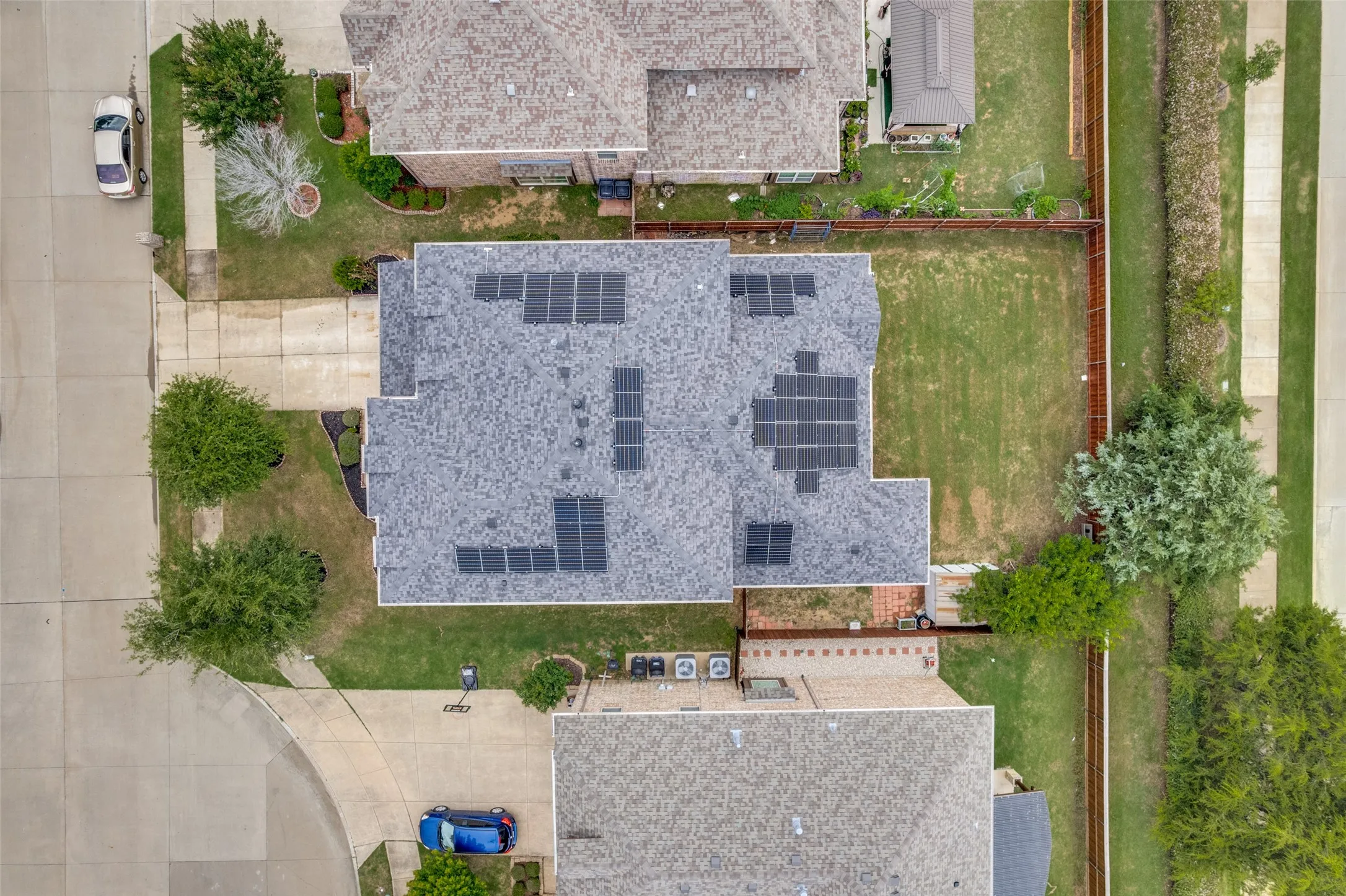 Composition shingle roof with multiple solar panel arrays