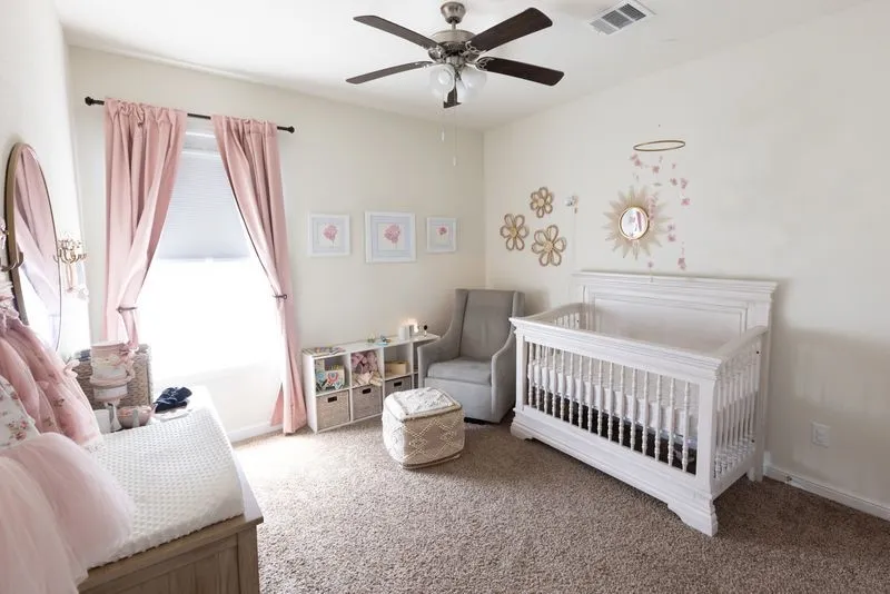 Room featuring a ceiling fan with integrated lighting, a window with roller shade, and plush carpet flooring