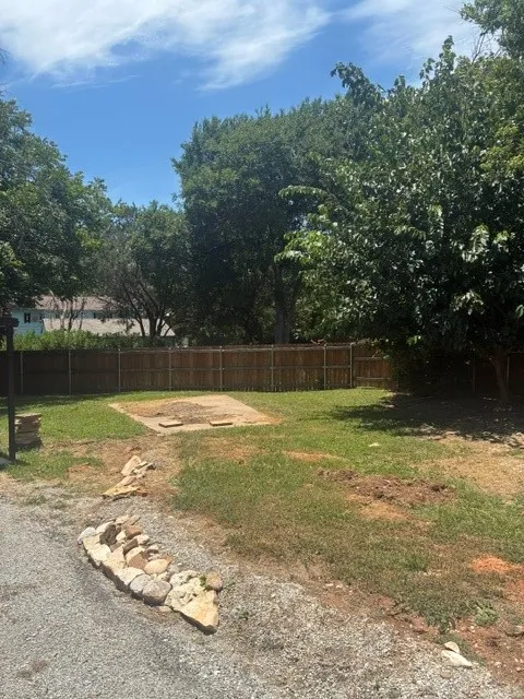 PARTIAL DRIVEWAY AND SOUTH SIDE YARD