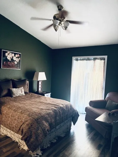 MASTER BEDROOM WITH SLIDING GLASS DOOR FACING WATER FROINTAGE