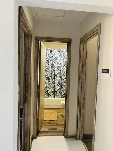 GUEST BATH ENTRANCE WITH TWO GUEST BEDROOMS ON EACH SIDE