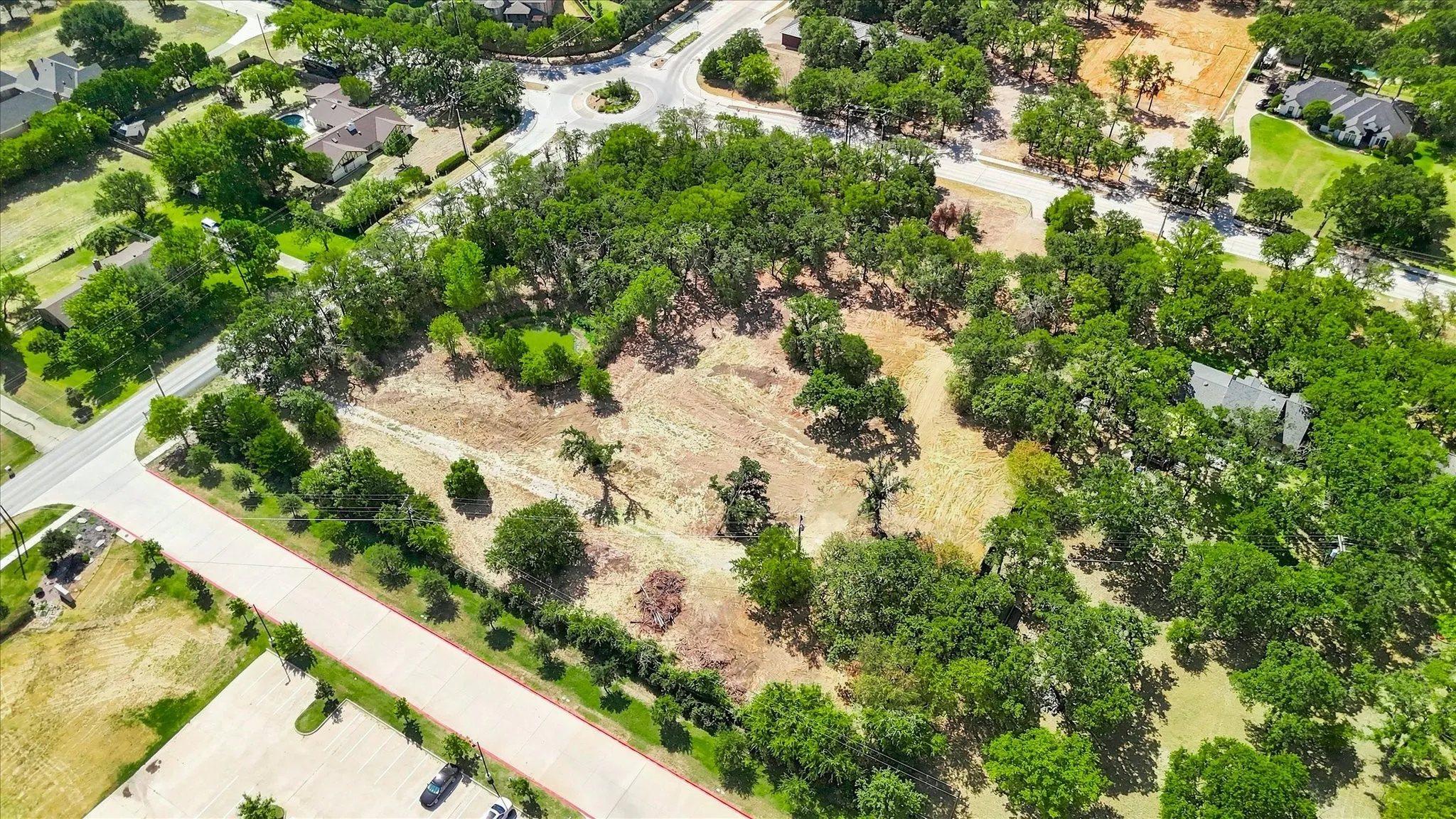 Expansive lot featuring a mix of mature trees and cleared areas
