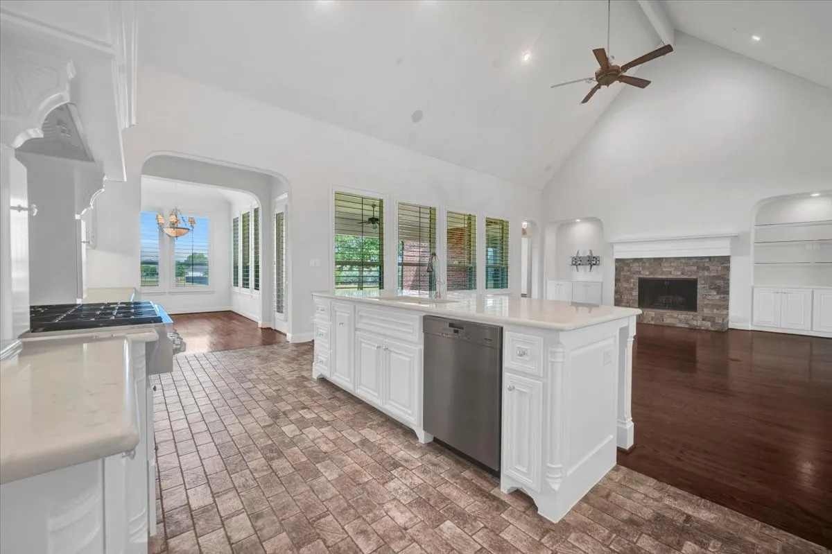 Another view of kitchen area showing island cabinetry & dishwasher
