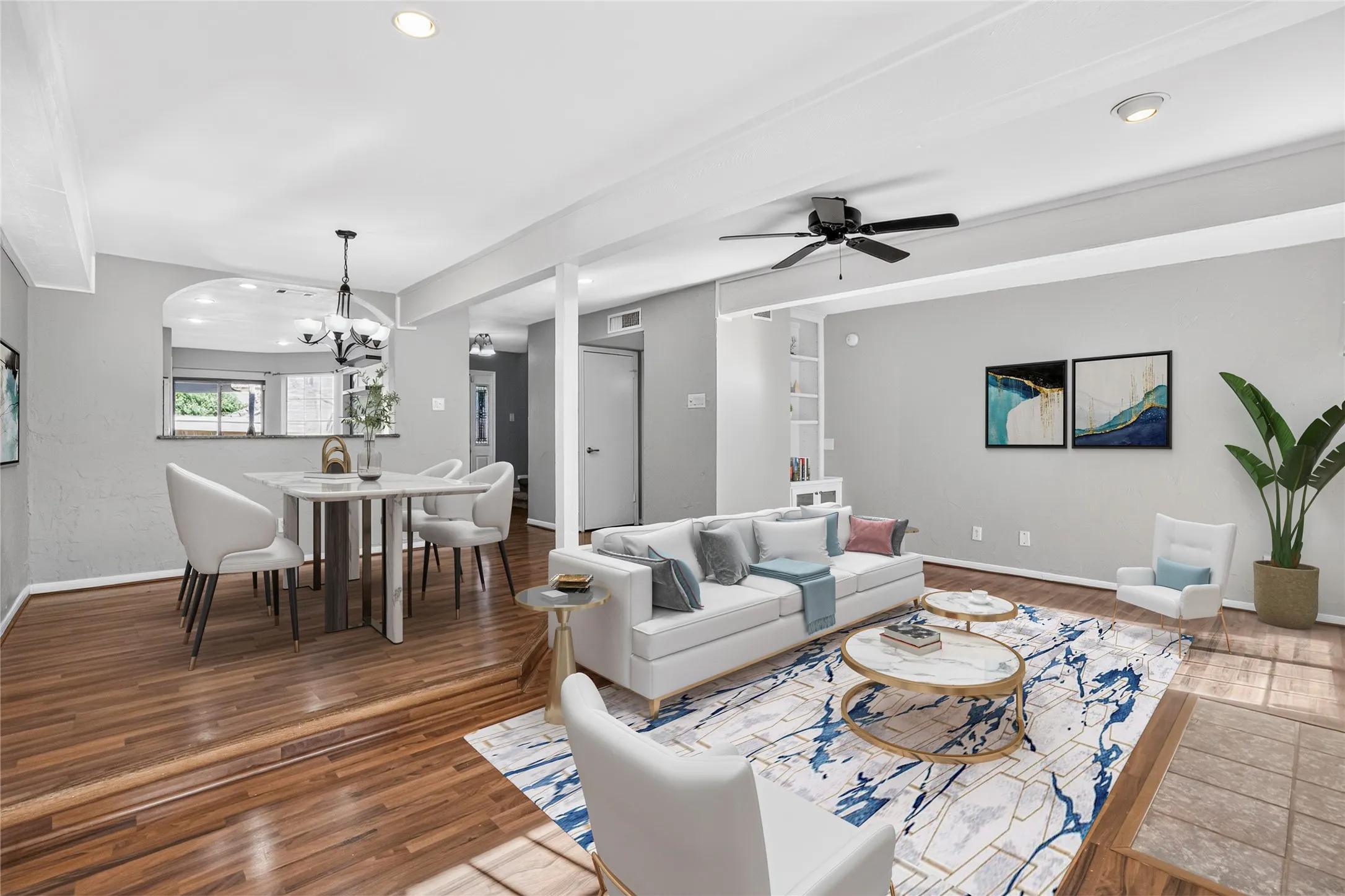 Wood-finish flooring throughout, recessed lighting, and a ceiling fan