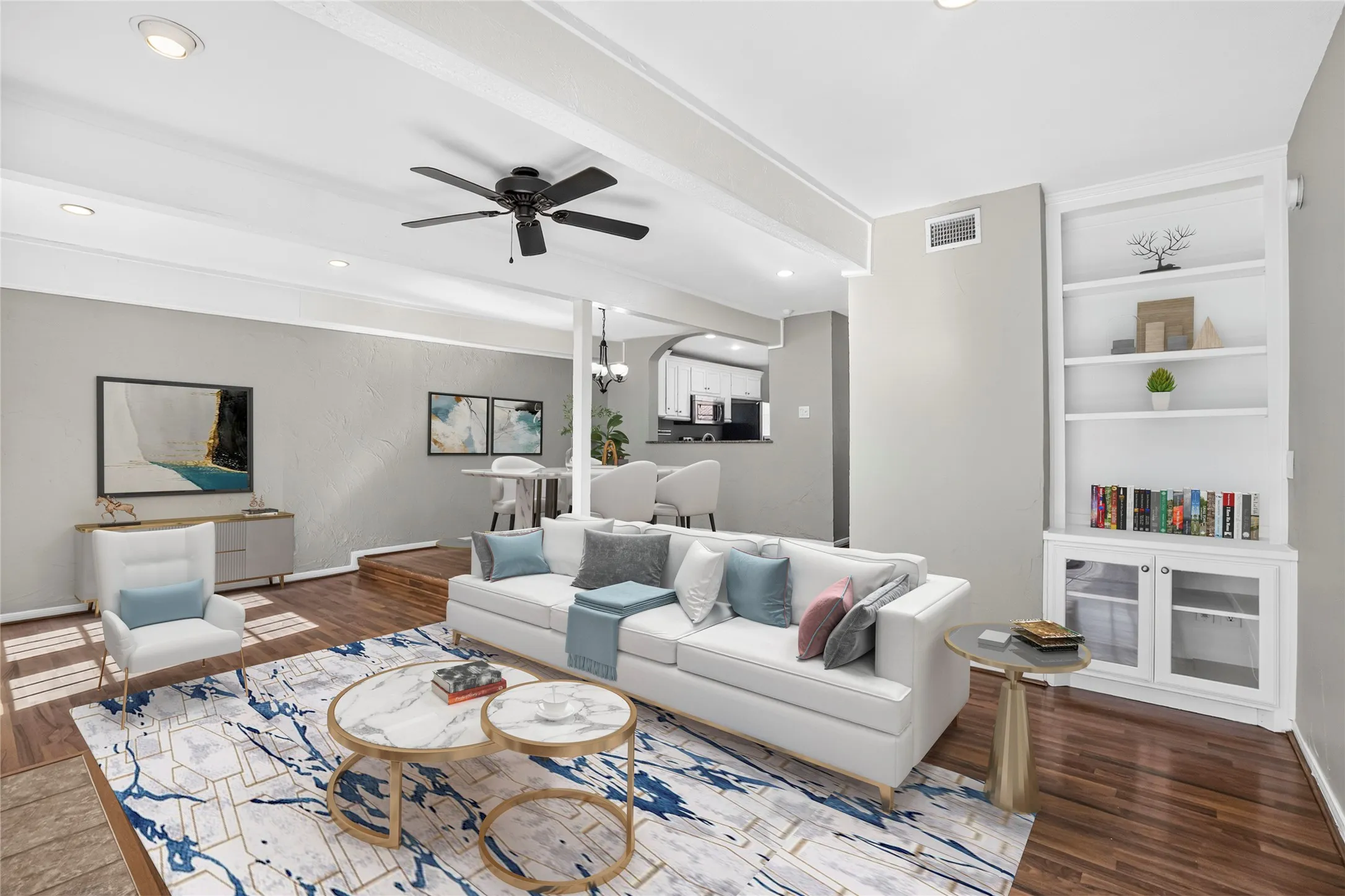 Spacious living area featuring wood-finish flooring, recessed lighting, and a ceiling fan