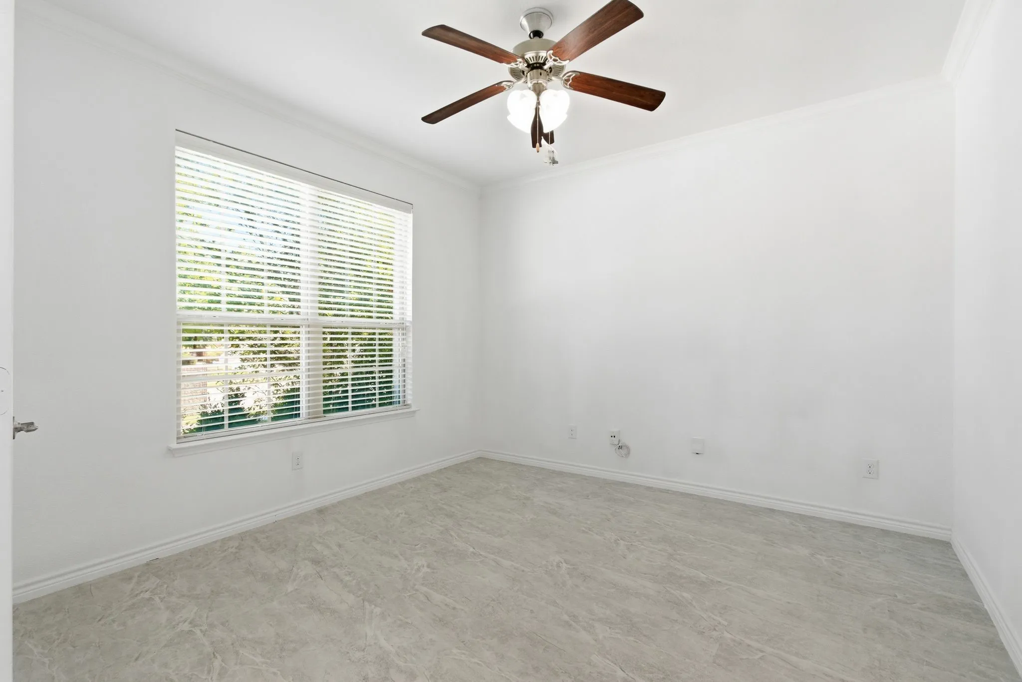 Recessed window with blinds, ceiling fan with light fixture, and crown molding