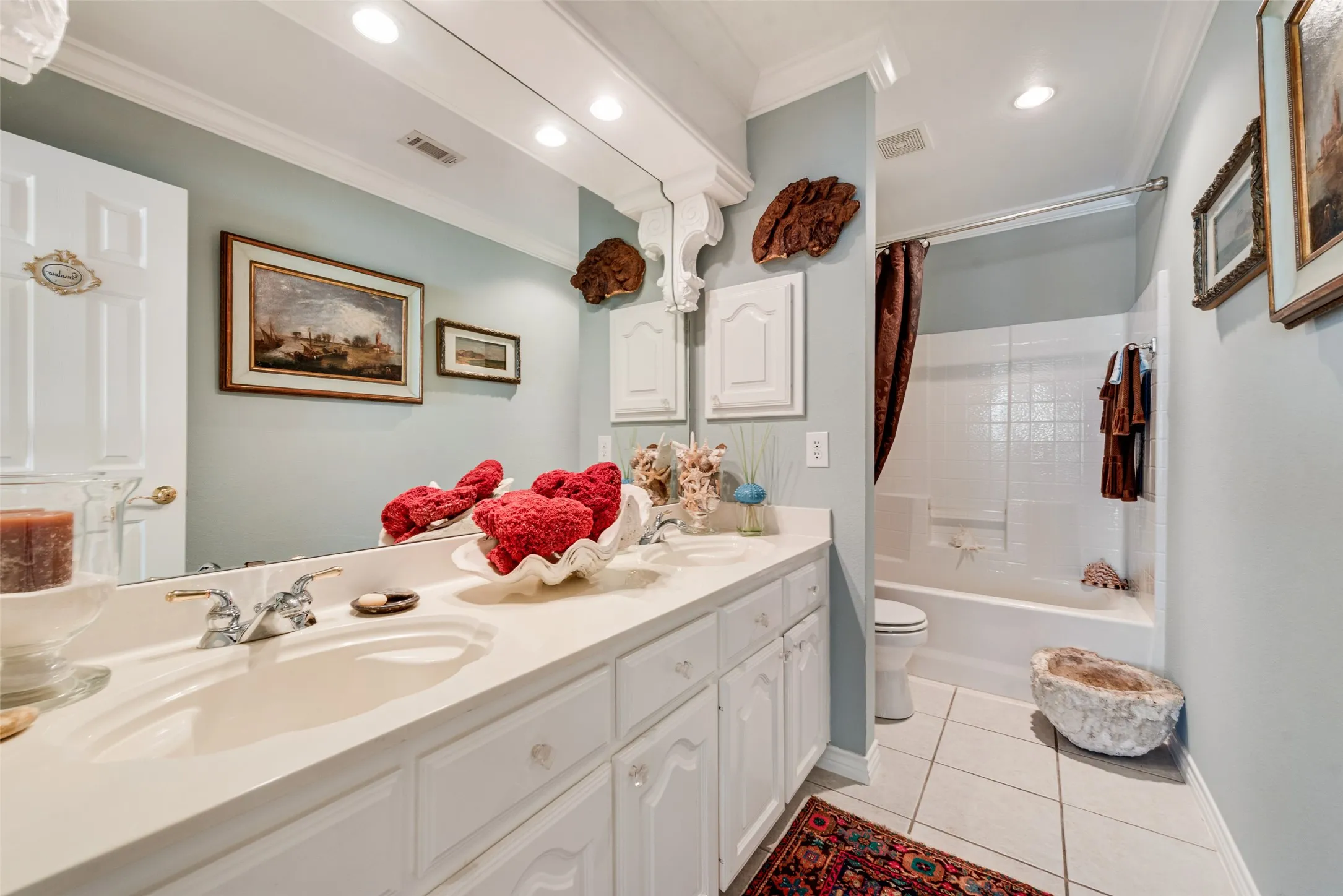 Double vanity with integrated sinks and chrome fixtures