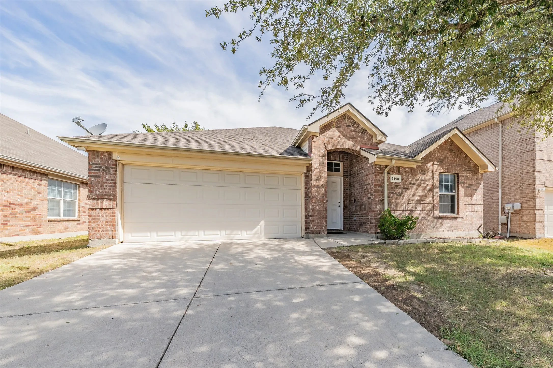 Spacious driveway with two cover car spaces.