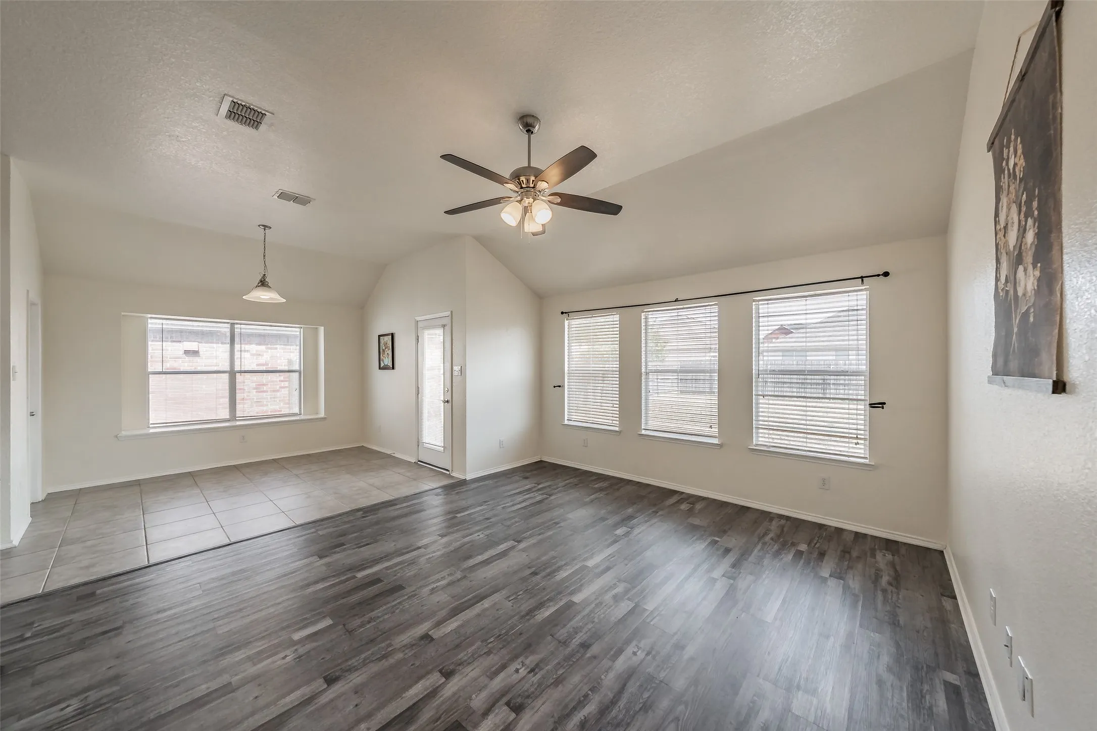Dining area with built-in blinds on the back door and a versatile window ledge for seating or decor.