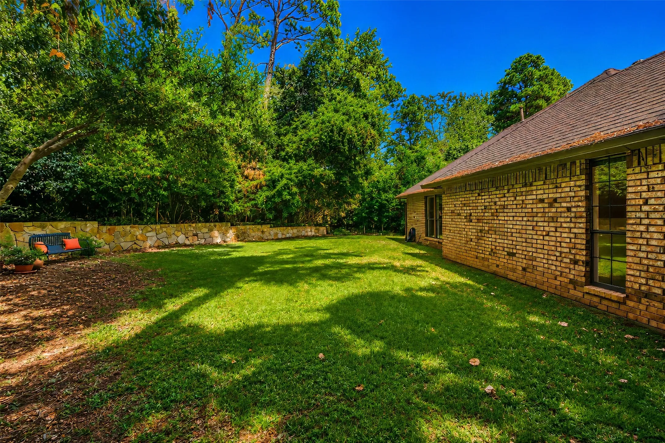 Stone retaining walls provide structure and charm.