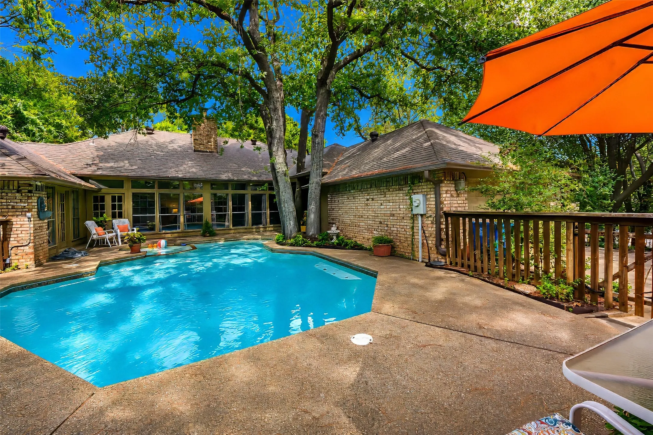 Courtyard pool is fenced and landscaped.