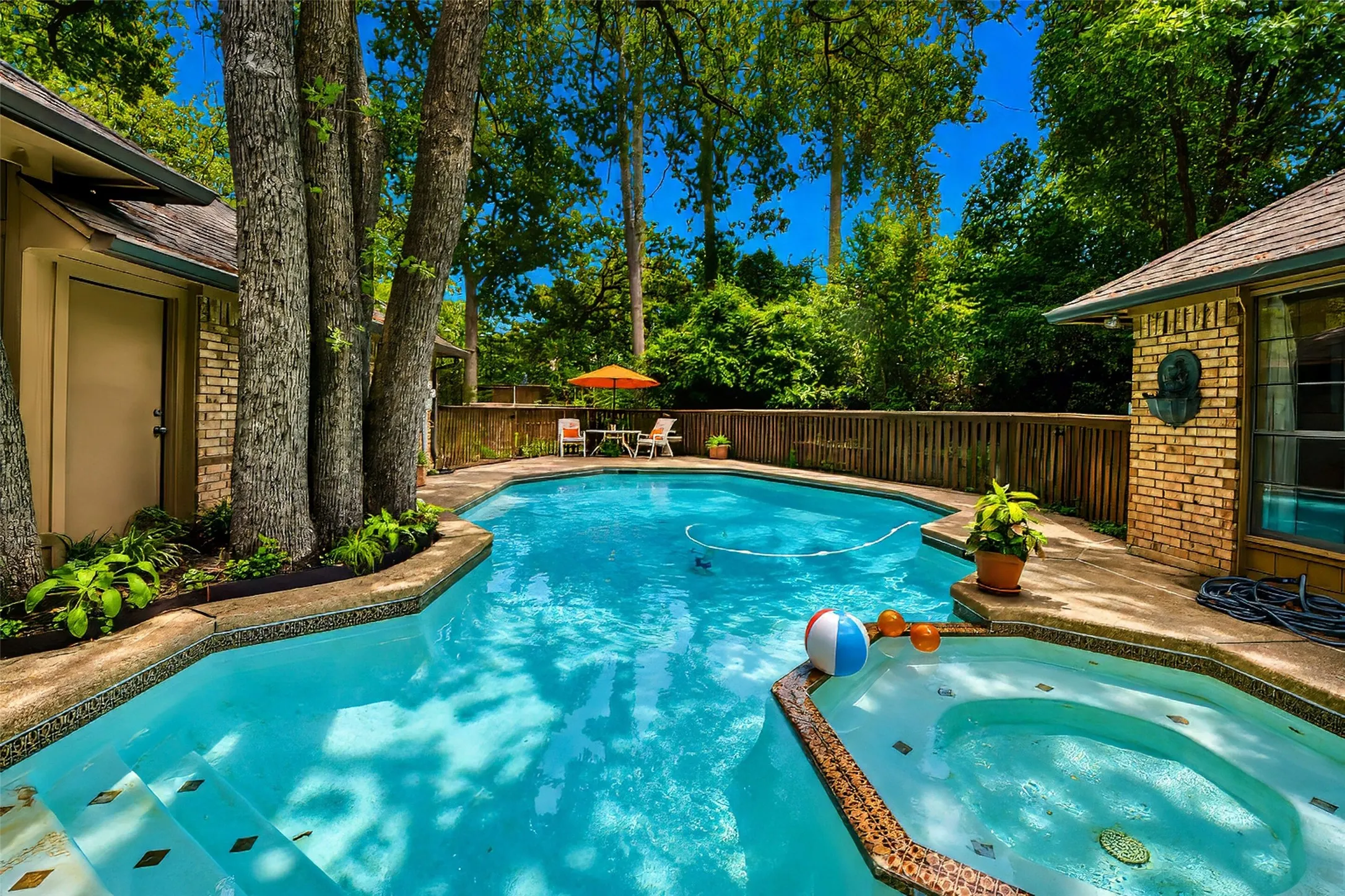 Custom gunite pool features both pool and spa.