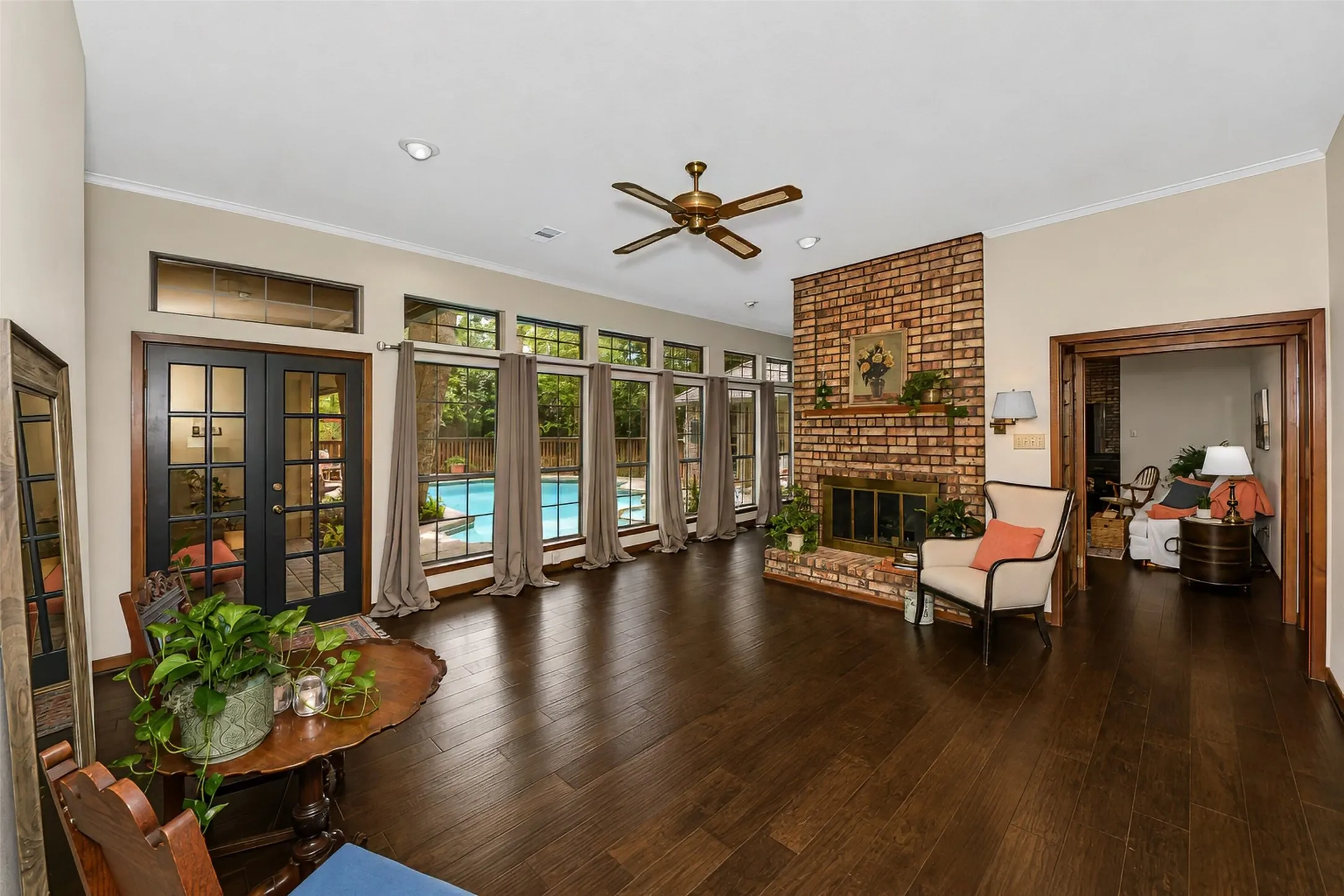 The home is set around a courtyard pool and a see through fireplace is enjoyed by two living areas.