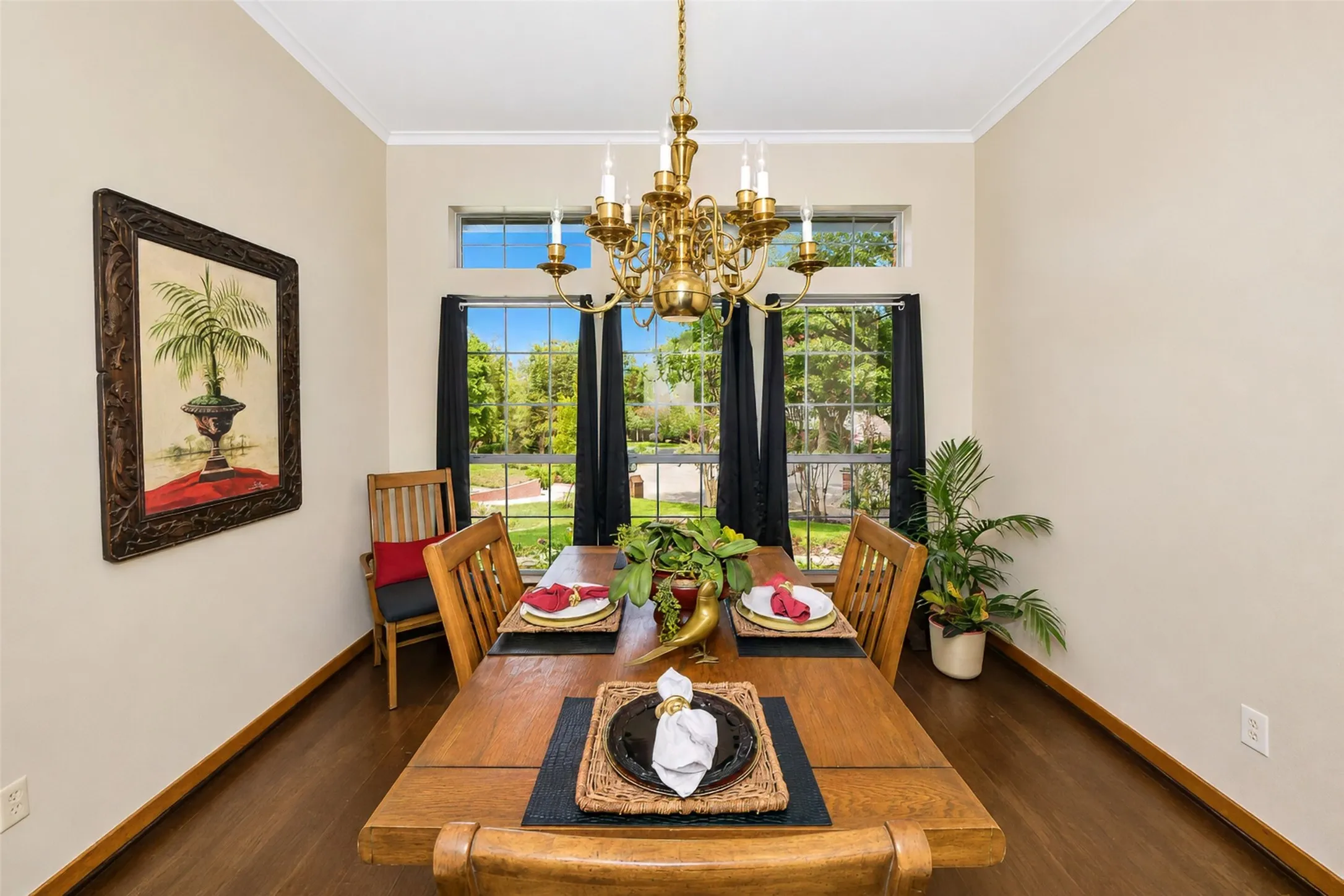 Beautiful formal dining overlooks landscaped areas and trees.