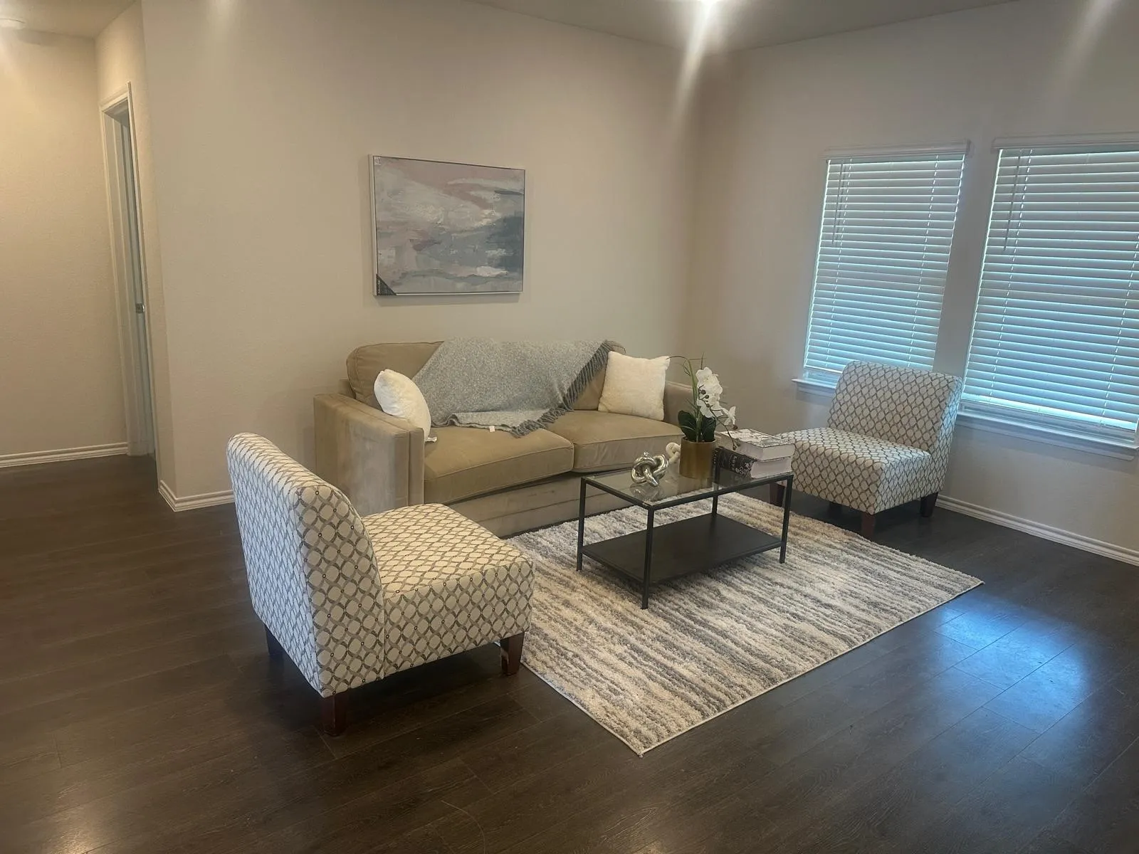 Hardwood-finish flooring, recessed lighting, and crisp white trim