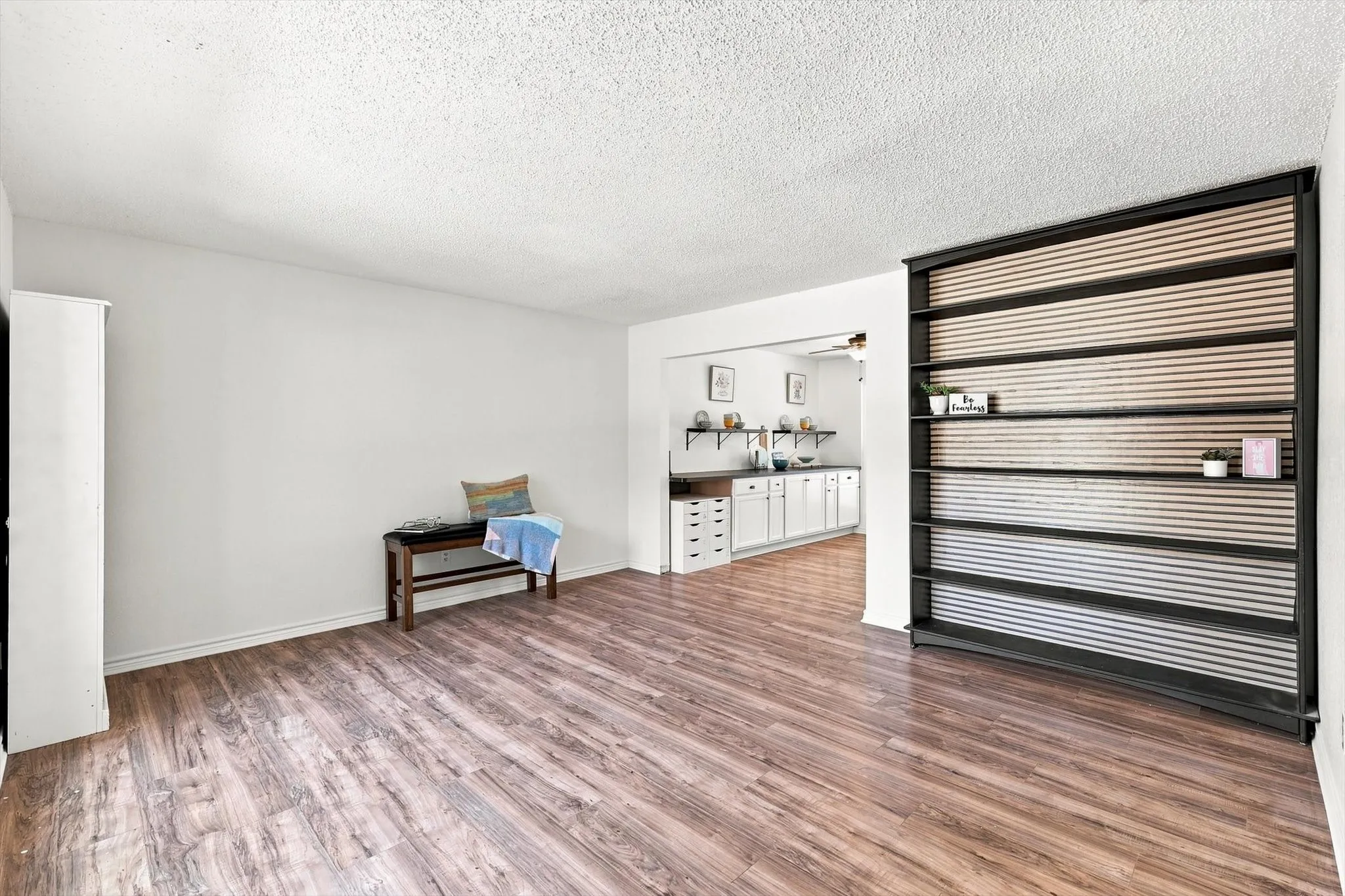 Front Living Room with Decorative Built in Shelves and access to the Dining Room