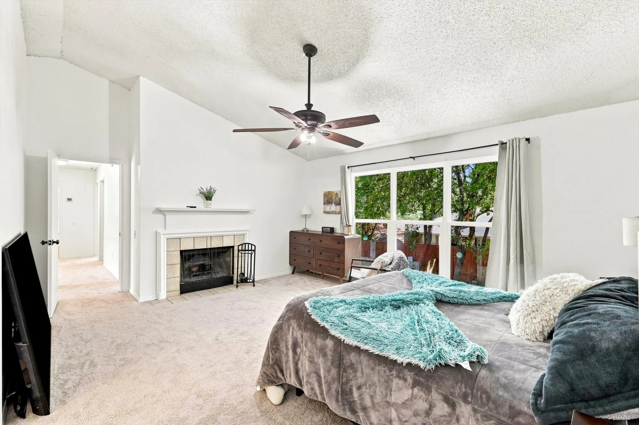 Owner's Suite Upstairs with Easy Access to the Kiddos.  Look at that Fireplace y'all!