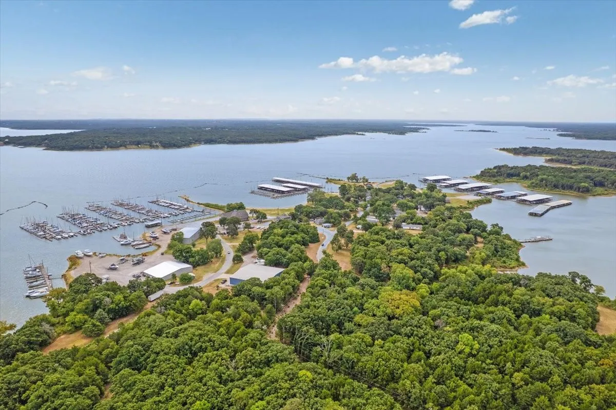 Expansive lake with multiple marinas and natural wooded areas