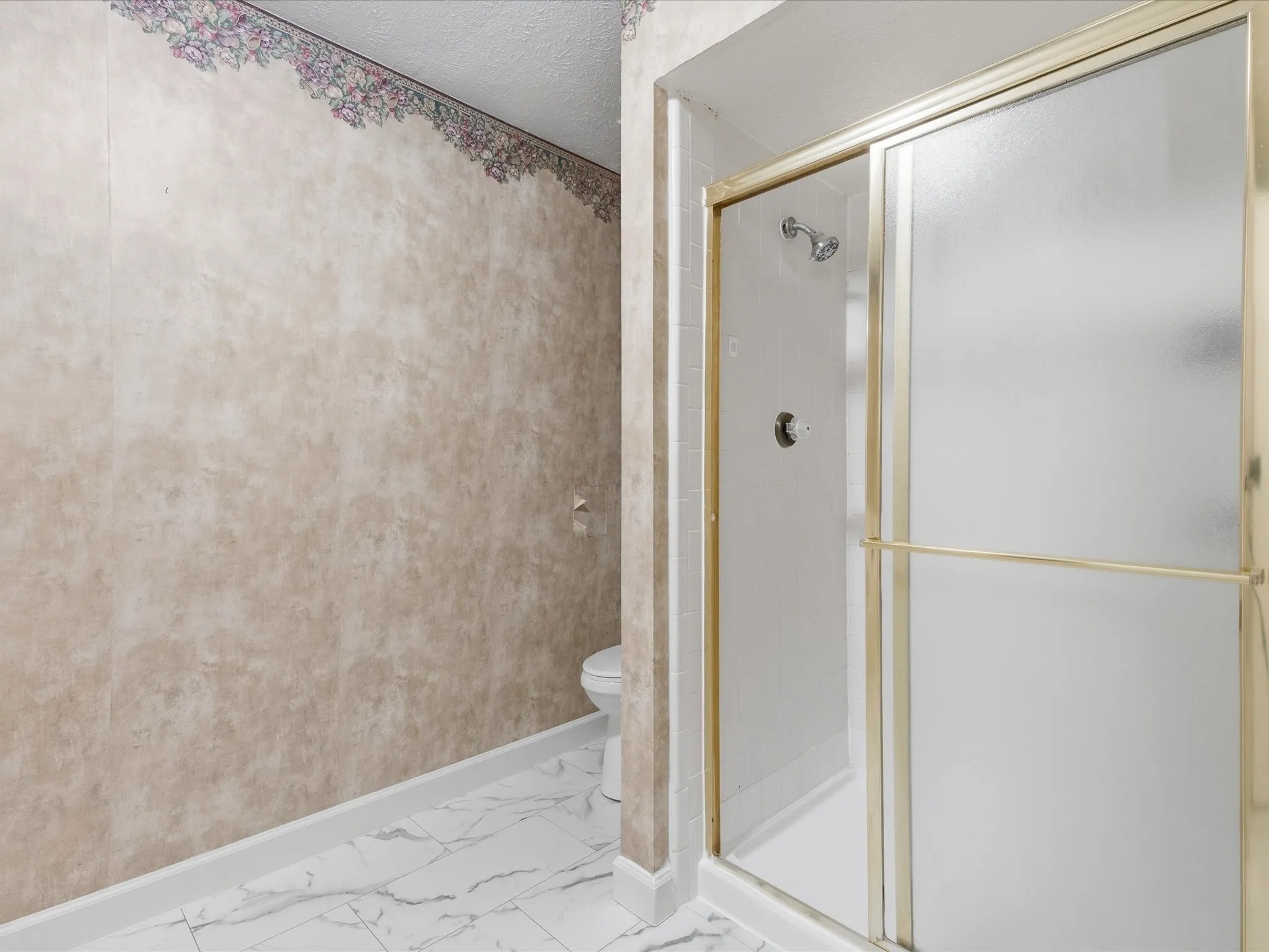 White tile flooring with grey veining