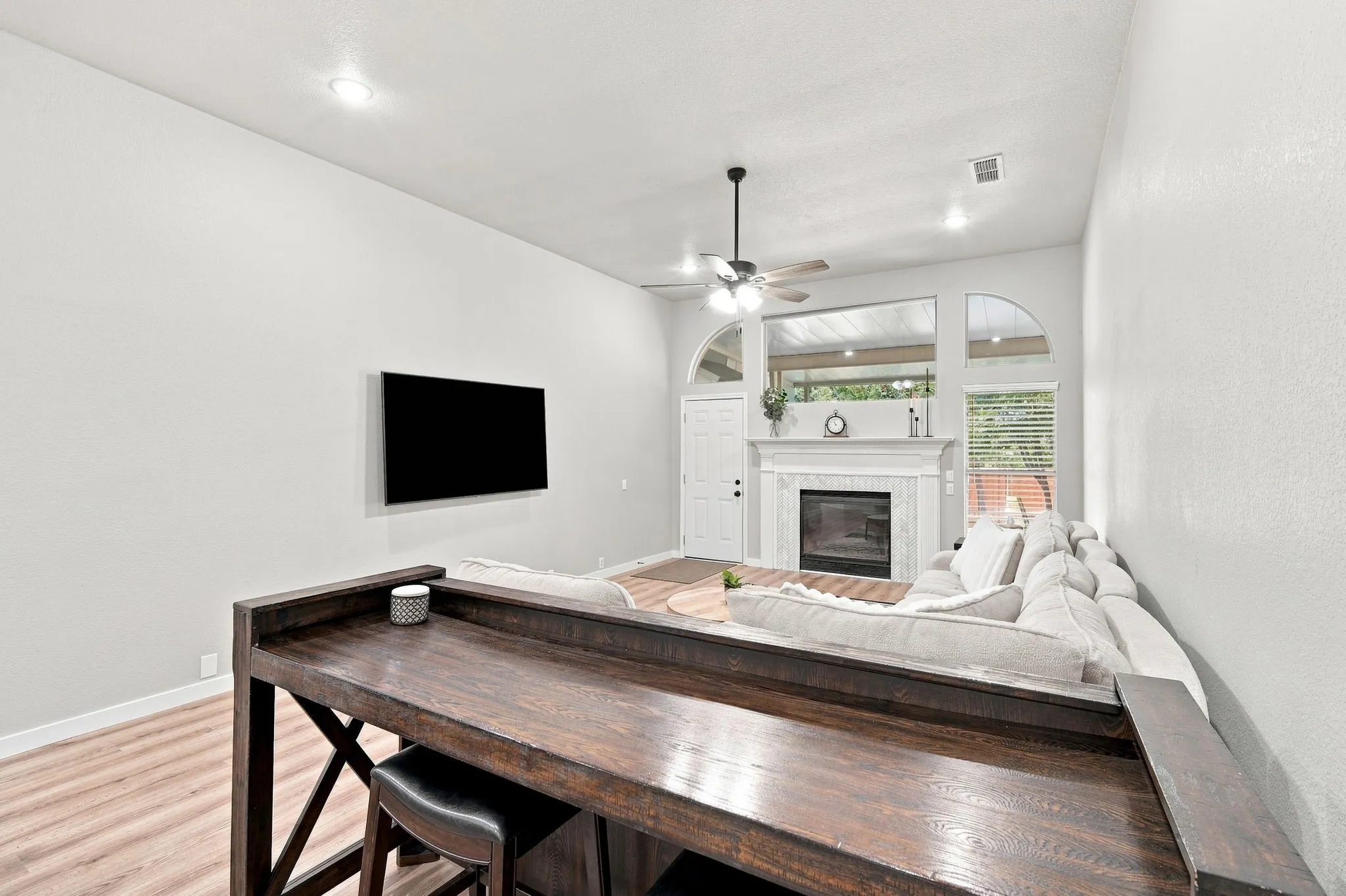 Family living area is large enough for all to enjoy.  Nice decorative fireplace with mantel.