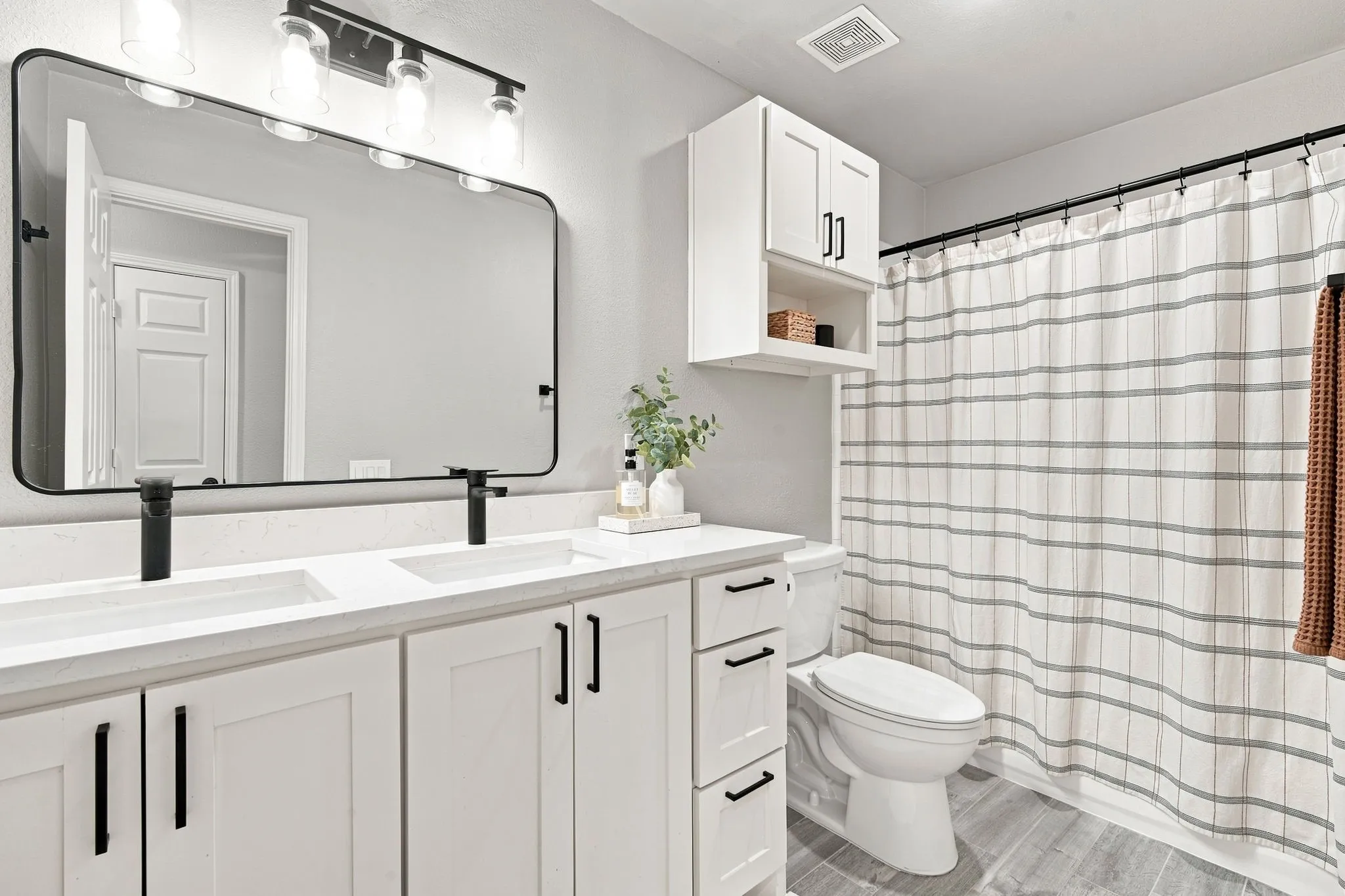 Second bathroom for guests is roomy.  Tub/shower, double vanity and updated.