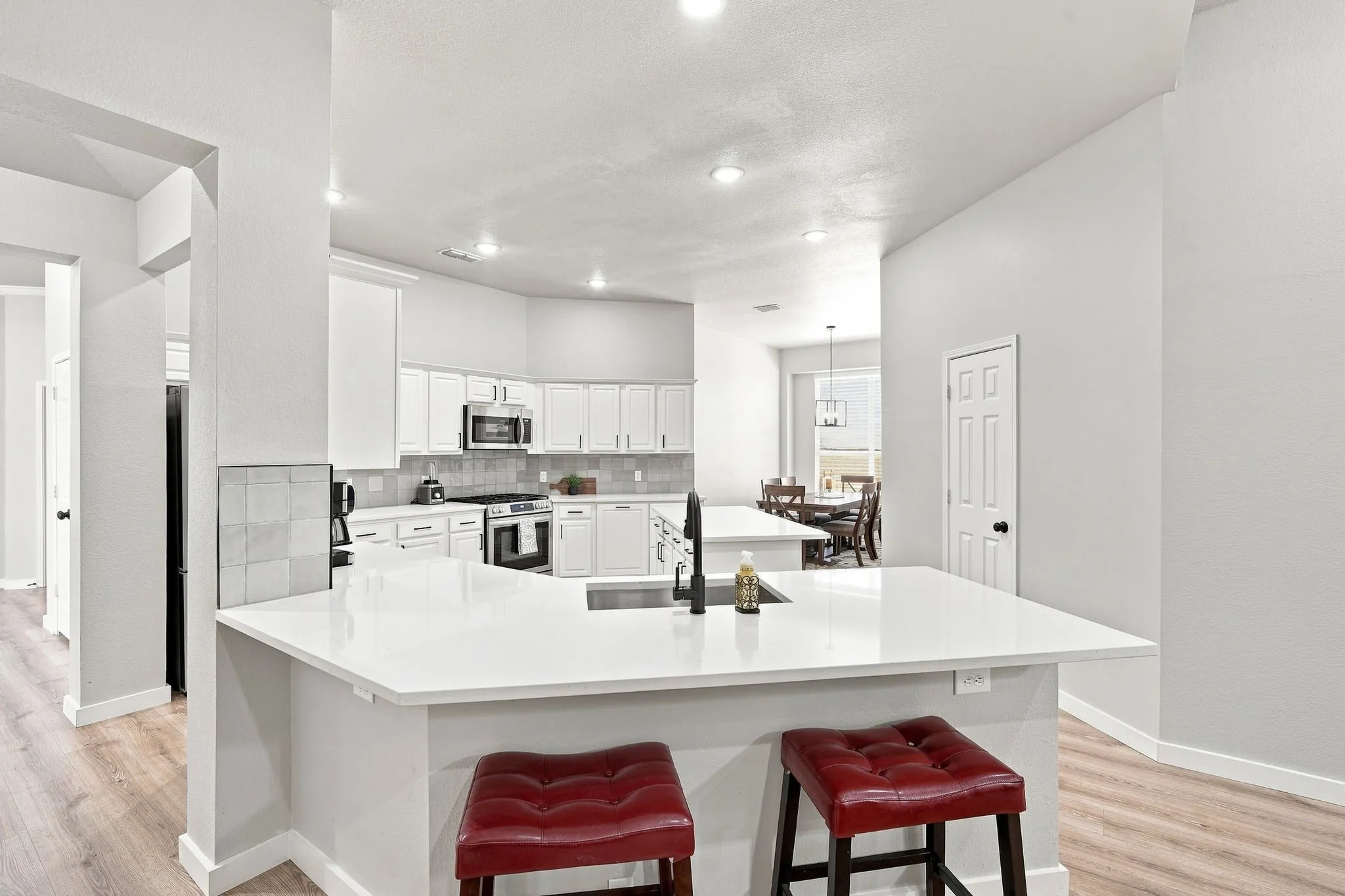 Spacious kitchen with breakfast bar and dining room.