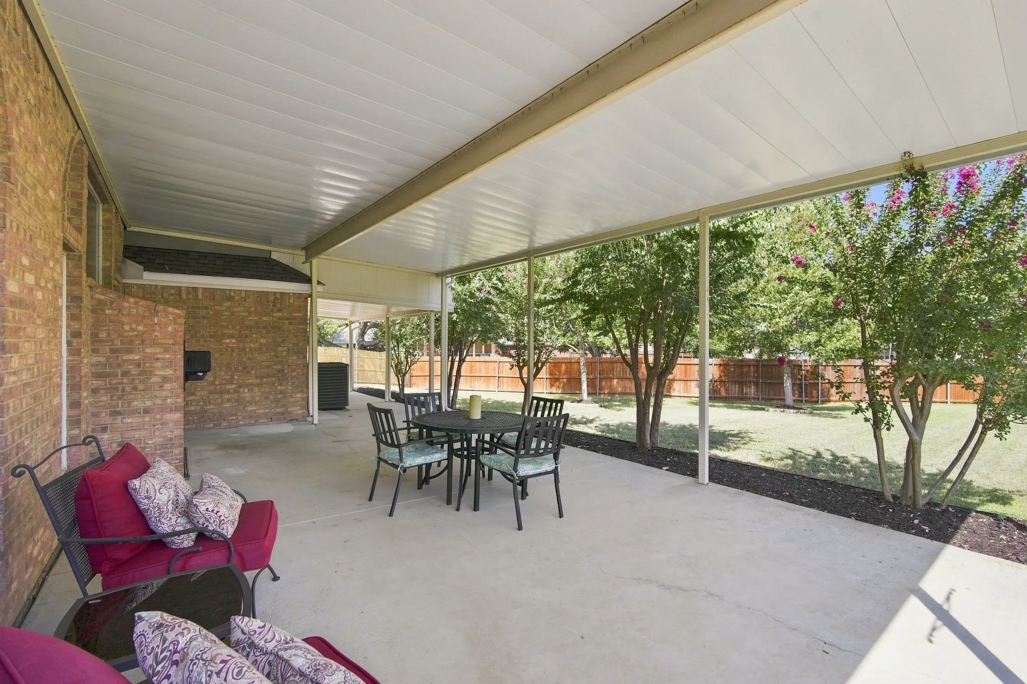 Step out back to this spacious patio and backyard.