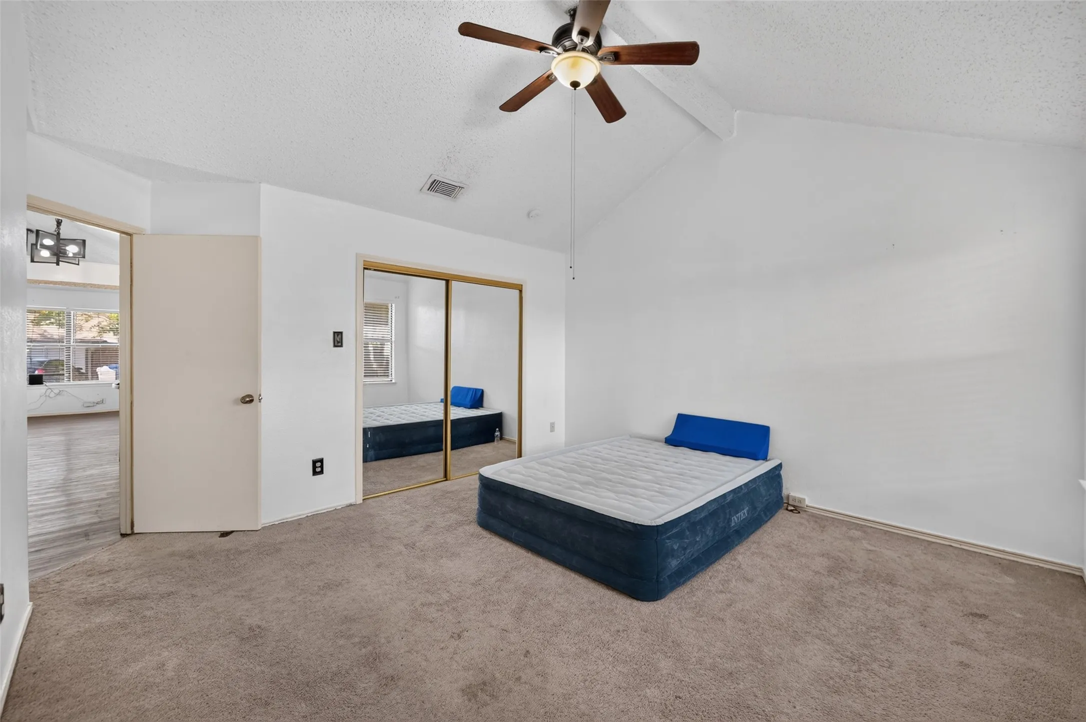 Vaulted ceiling with an attached ceiling fan