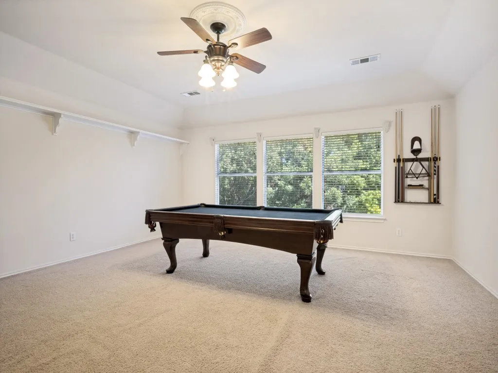 Upstairs bonus room - pool table conveys if buyer is interested.