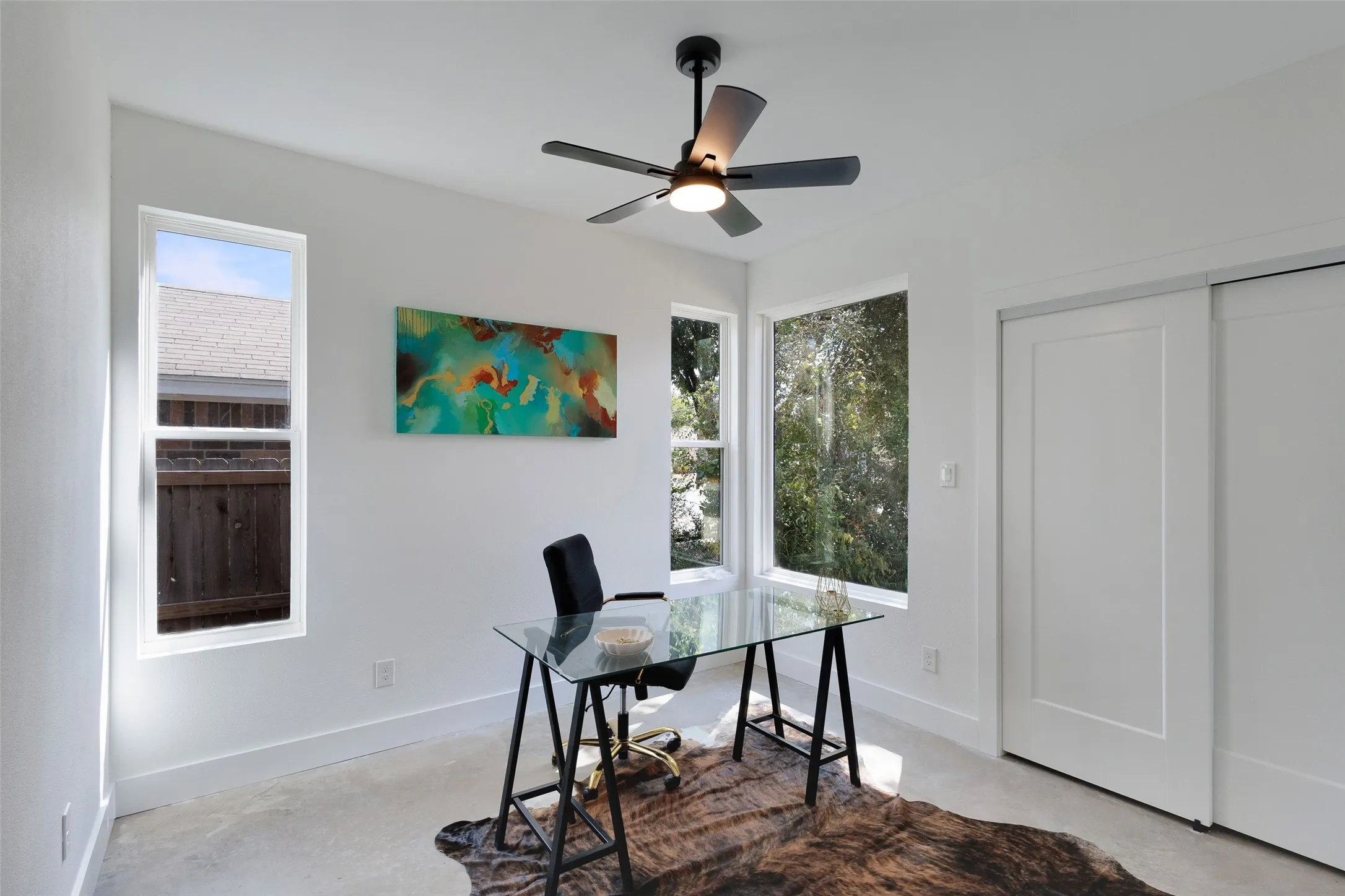 White walls, recessed lighting, and a ceiling fan with integrated light
