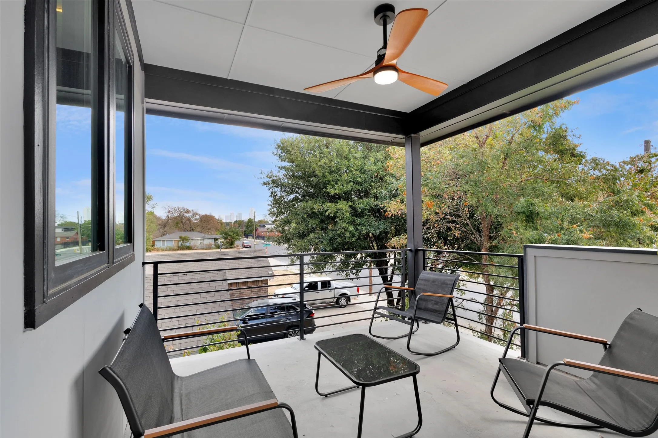 Covered front balcony with skyline views
