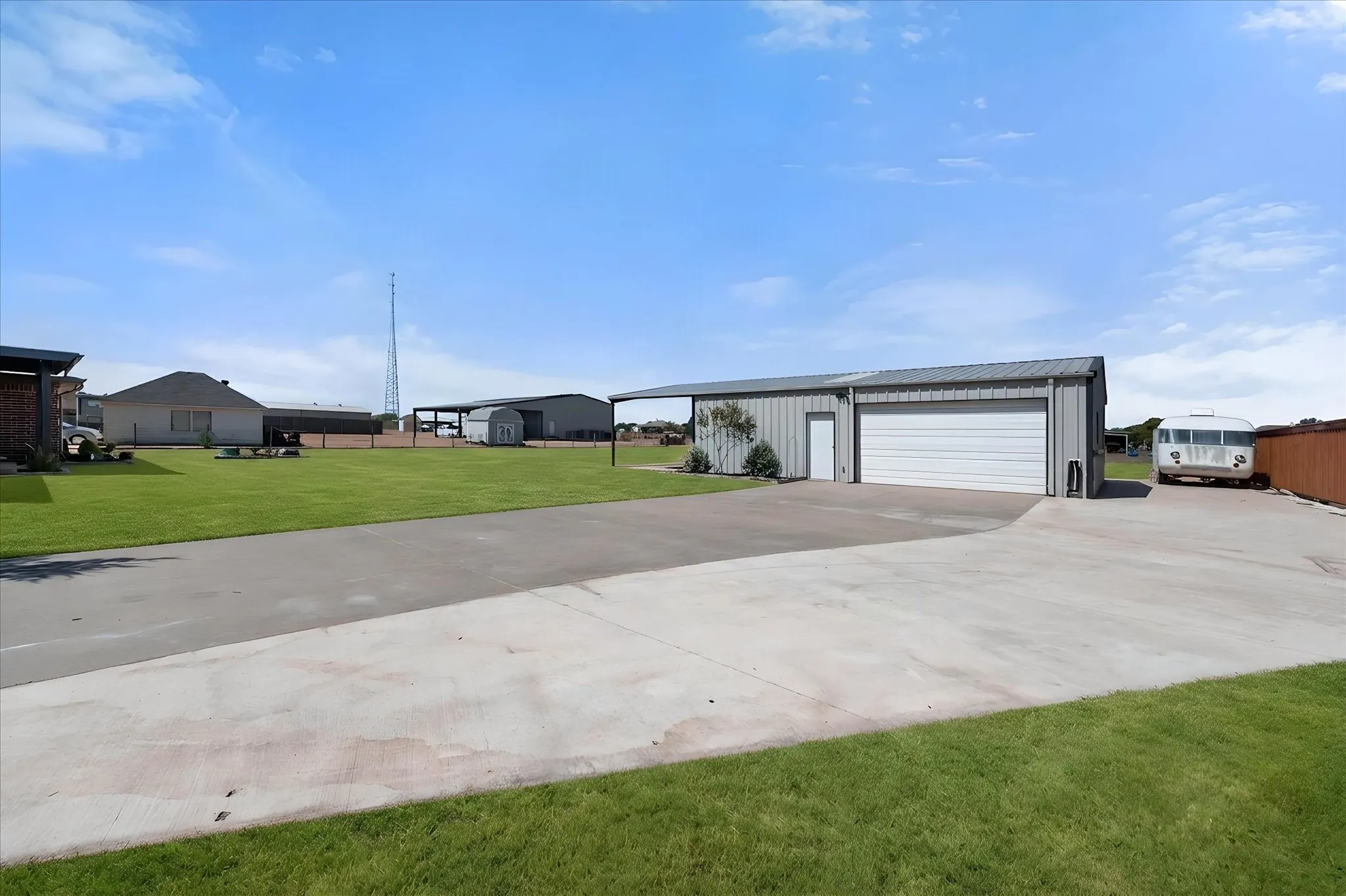 A 30 x 40 ft garage and workshop.  Extended and widened Concrete driveways great for RV and boat parking ,