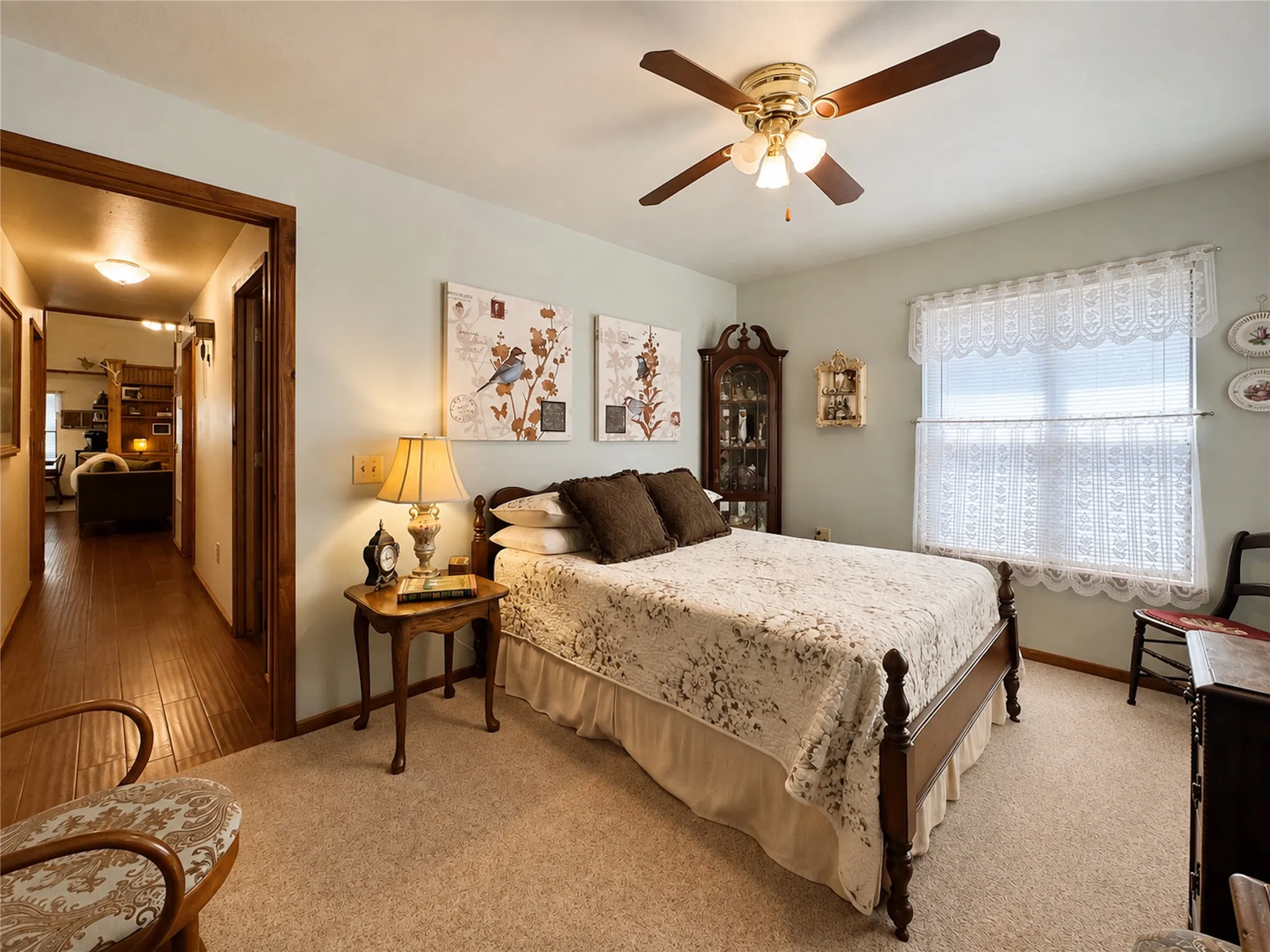 Room with neutral carpeting and light-toned walls