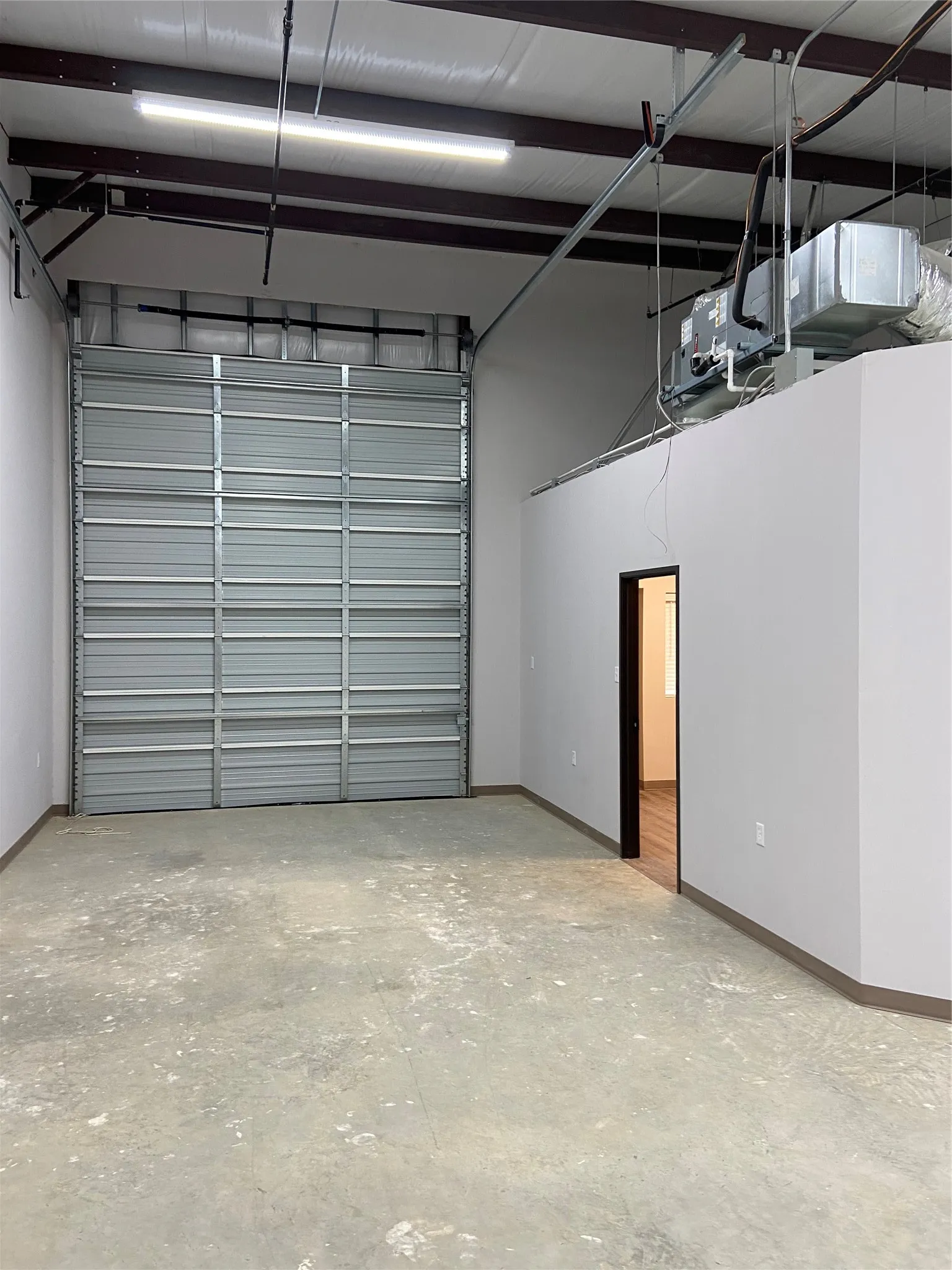 Warehouse space and overhead door with office entry