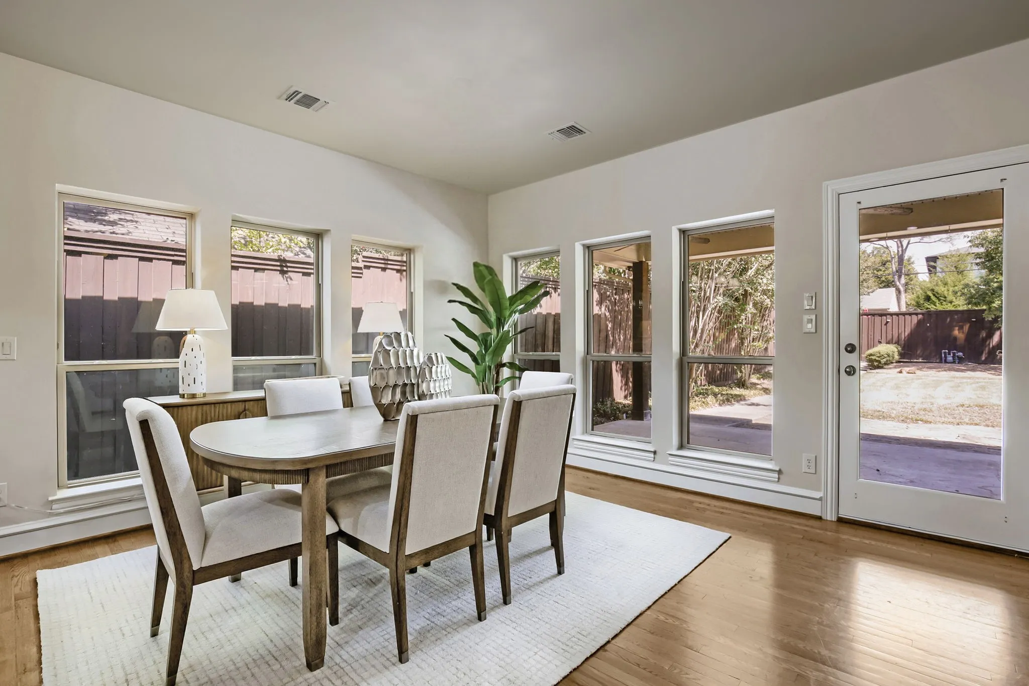 Large dining area with view to backyard.