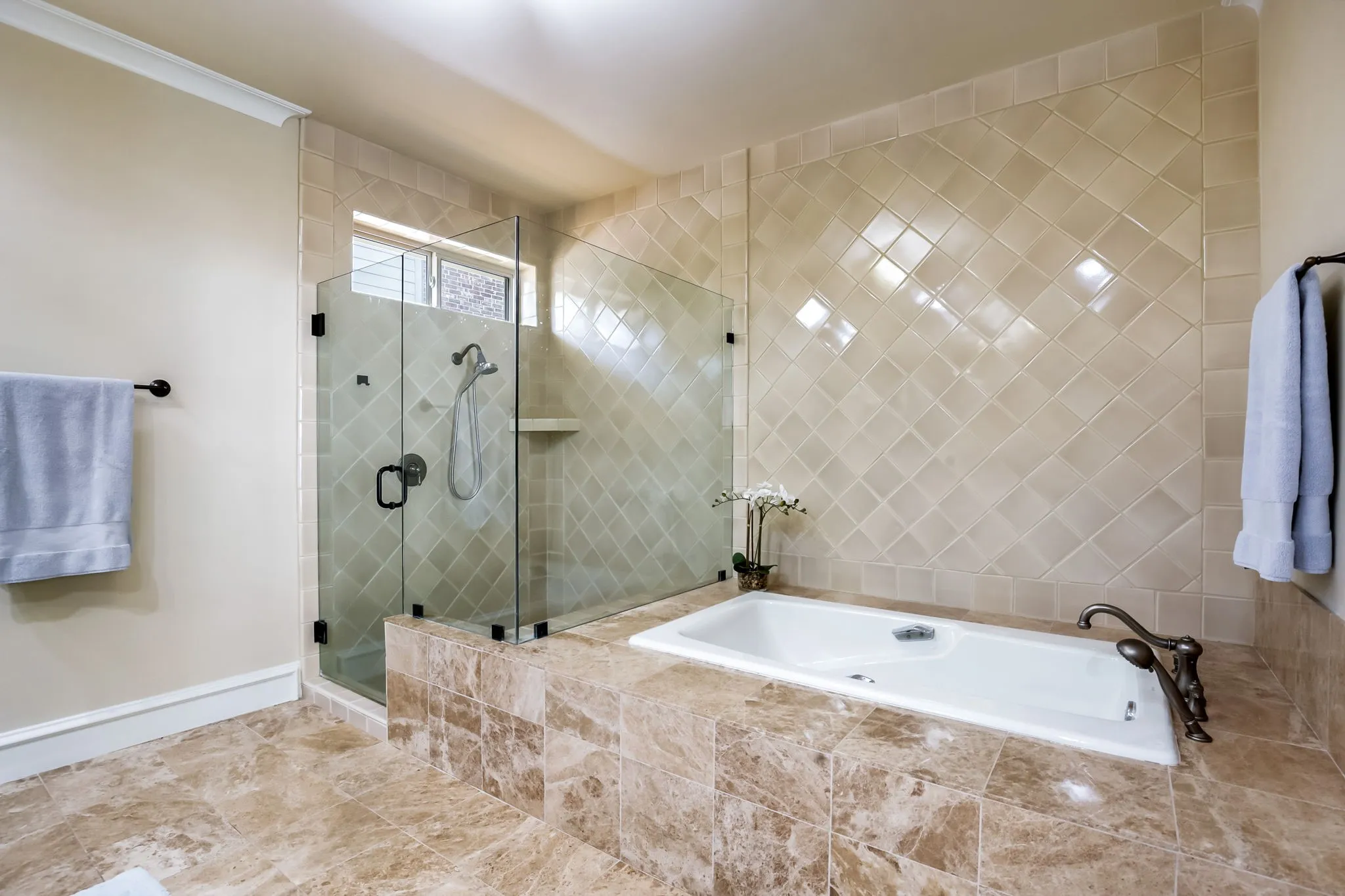 Oversized garden tub and huge walk in shower.