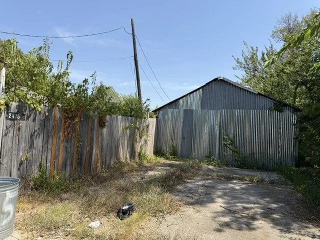 Back of garage-workshop, view from alley with rear driveway