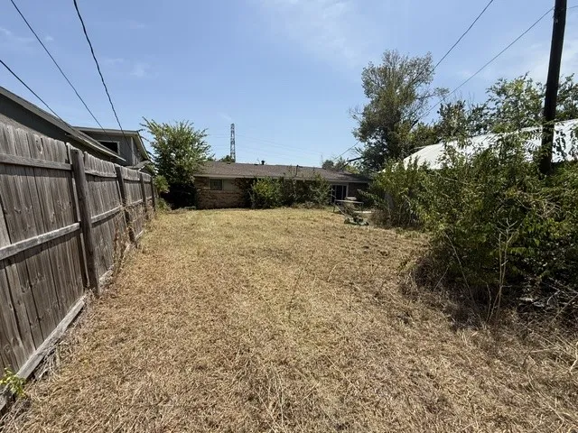 Large backyard beside garage-workshop