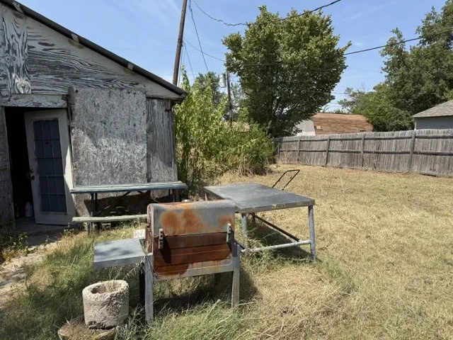 Garage-workshop with large yard beside it
