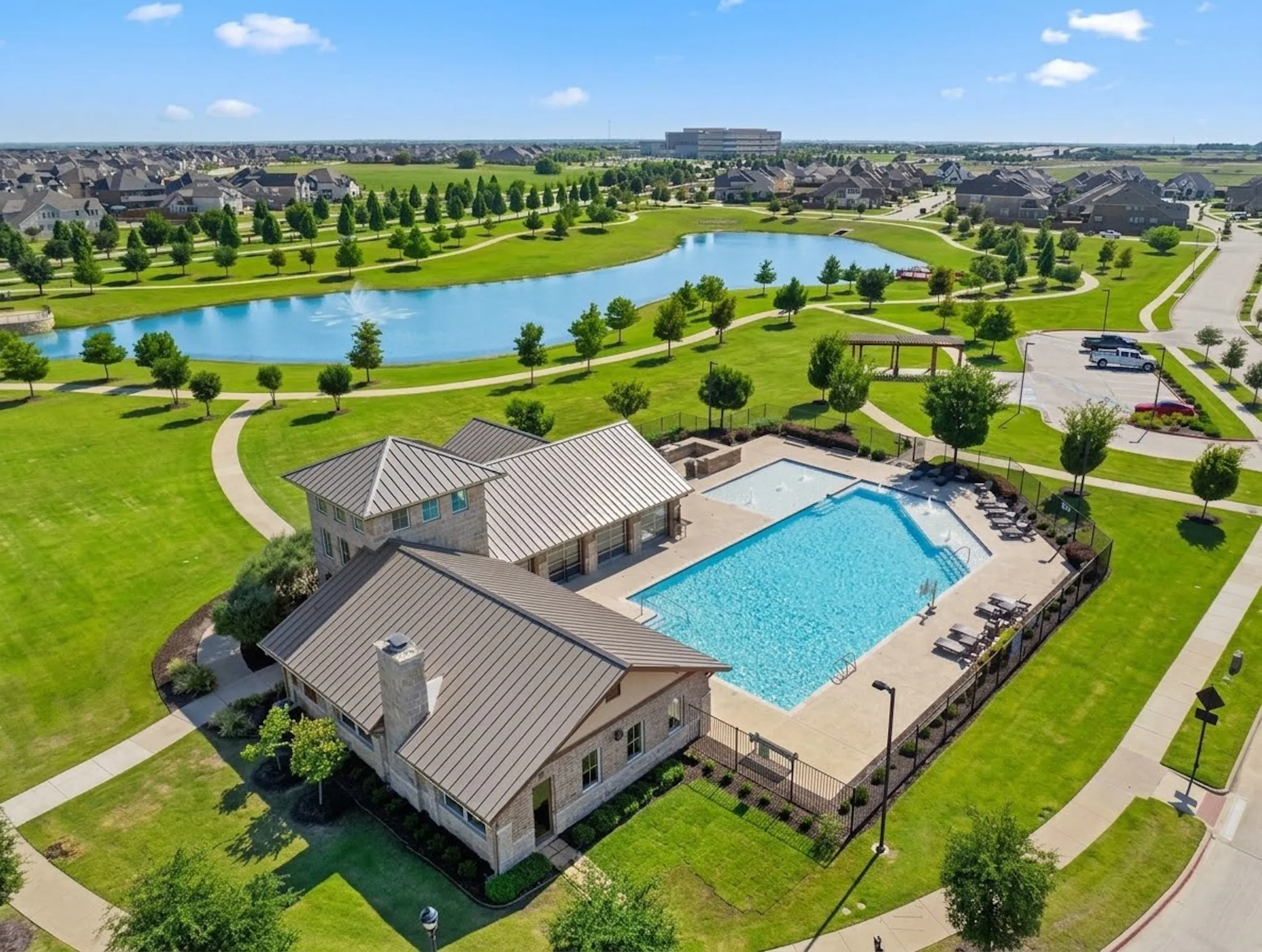 Community resort style pool with lake.