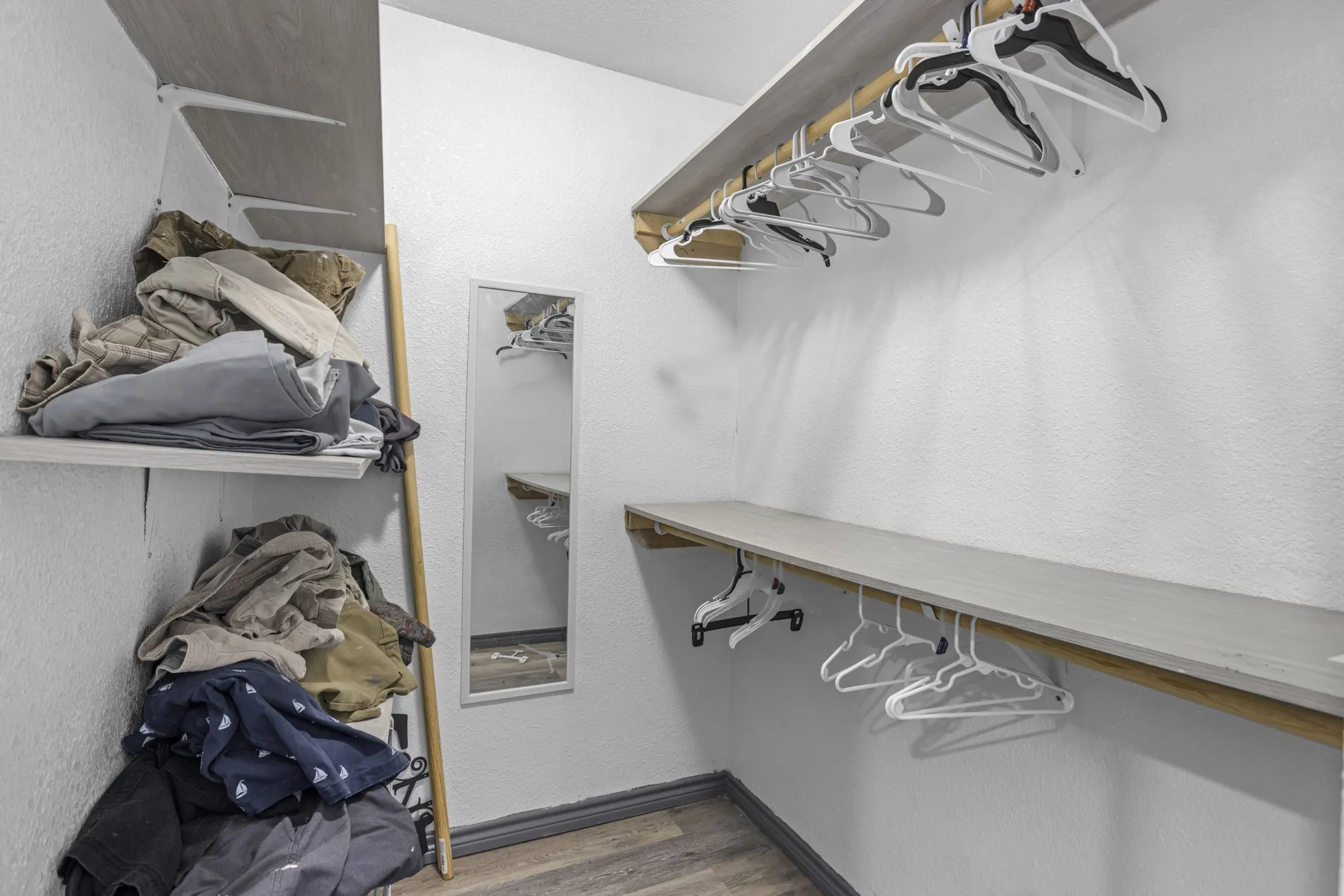 Walk in closet featuring wood finished floors