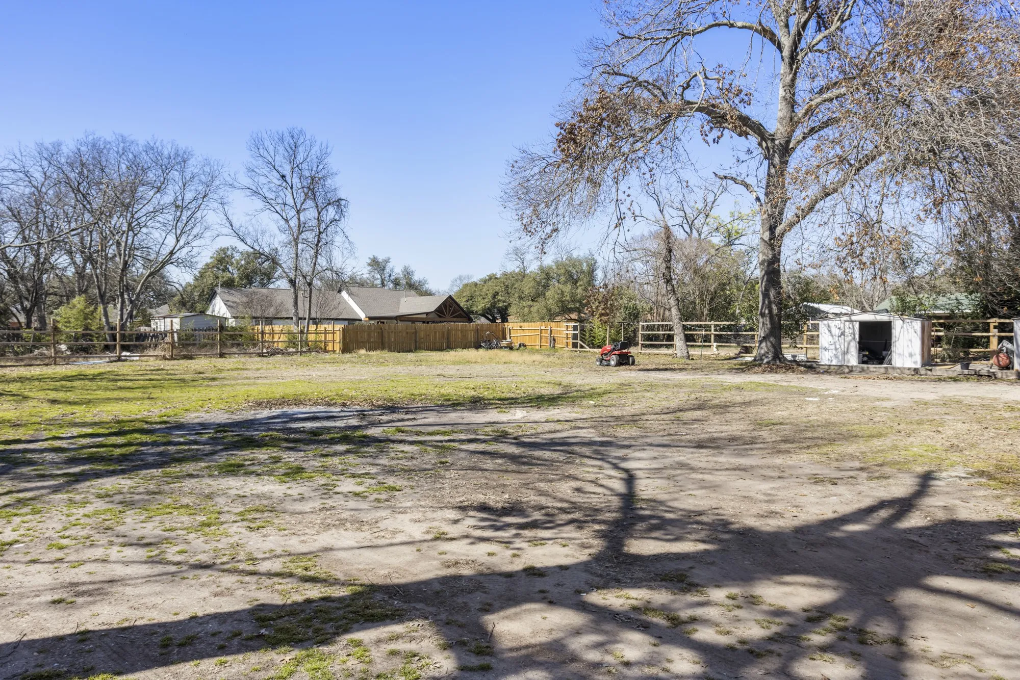View of yard with a storage unit