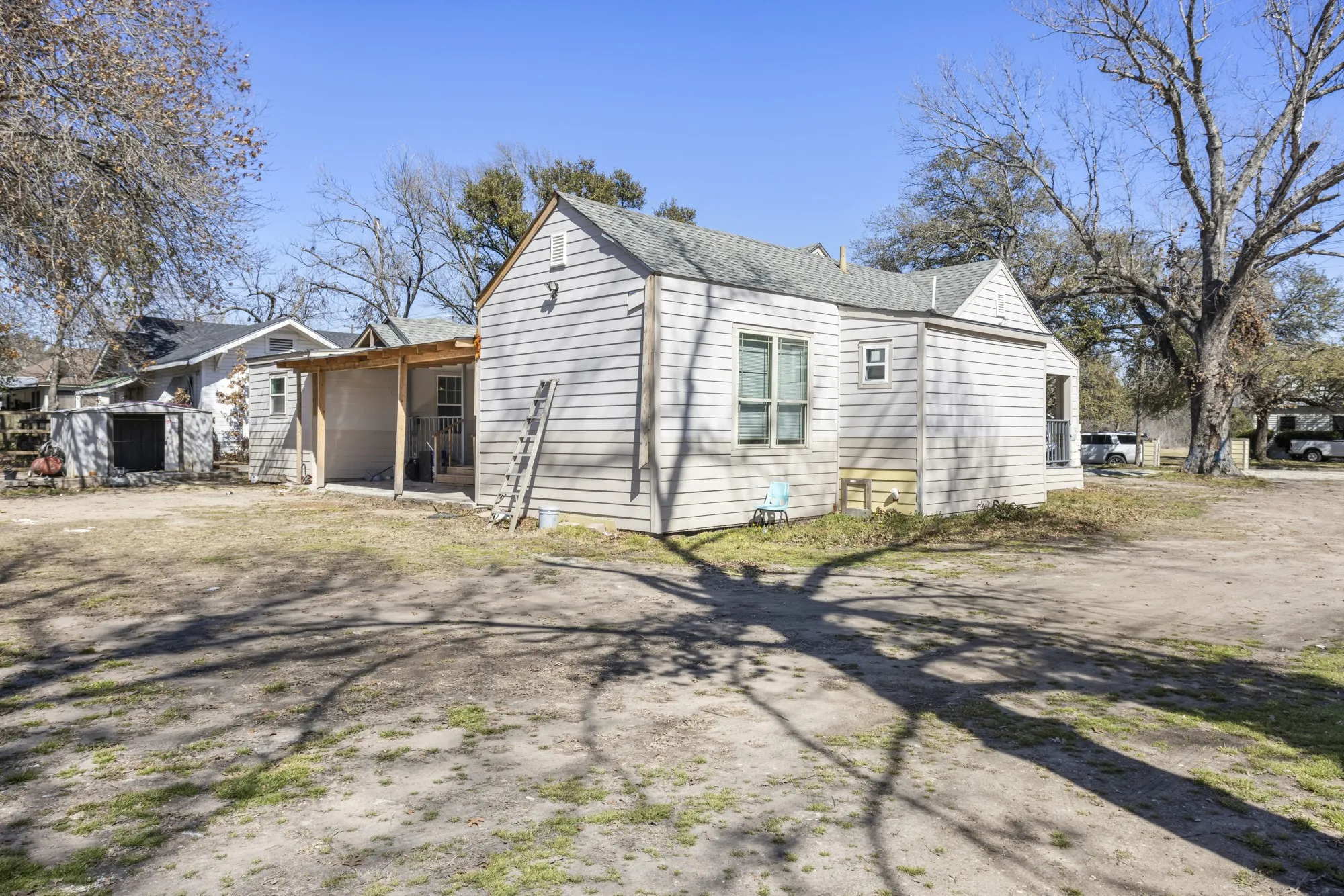 View of home's exterior with roof with shingles