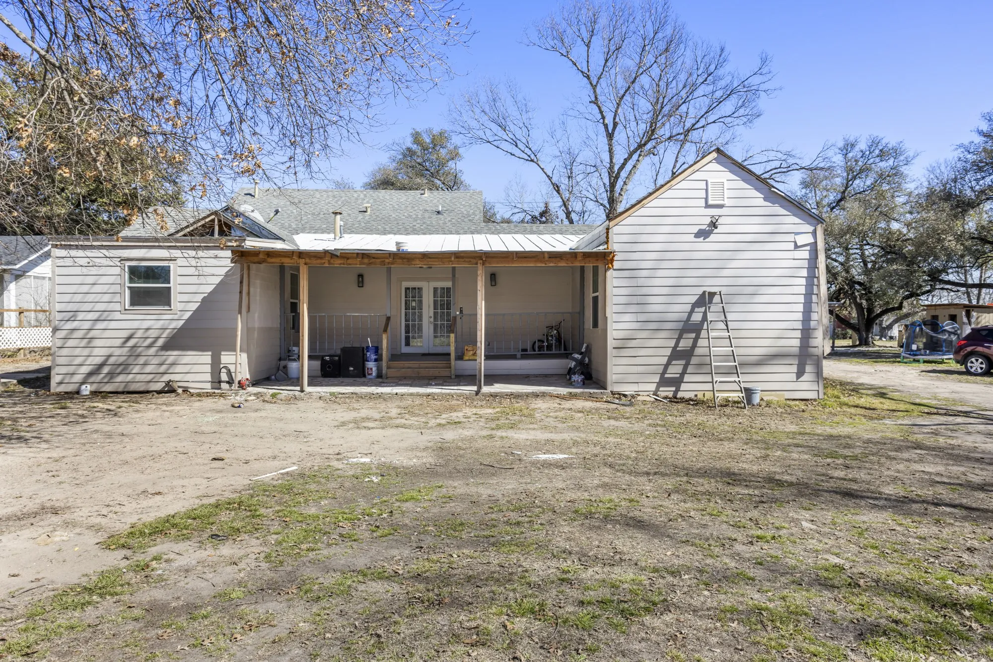 Rear view of property with french doors